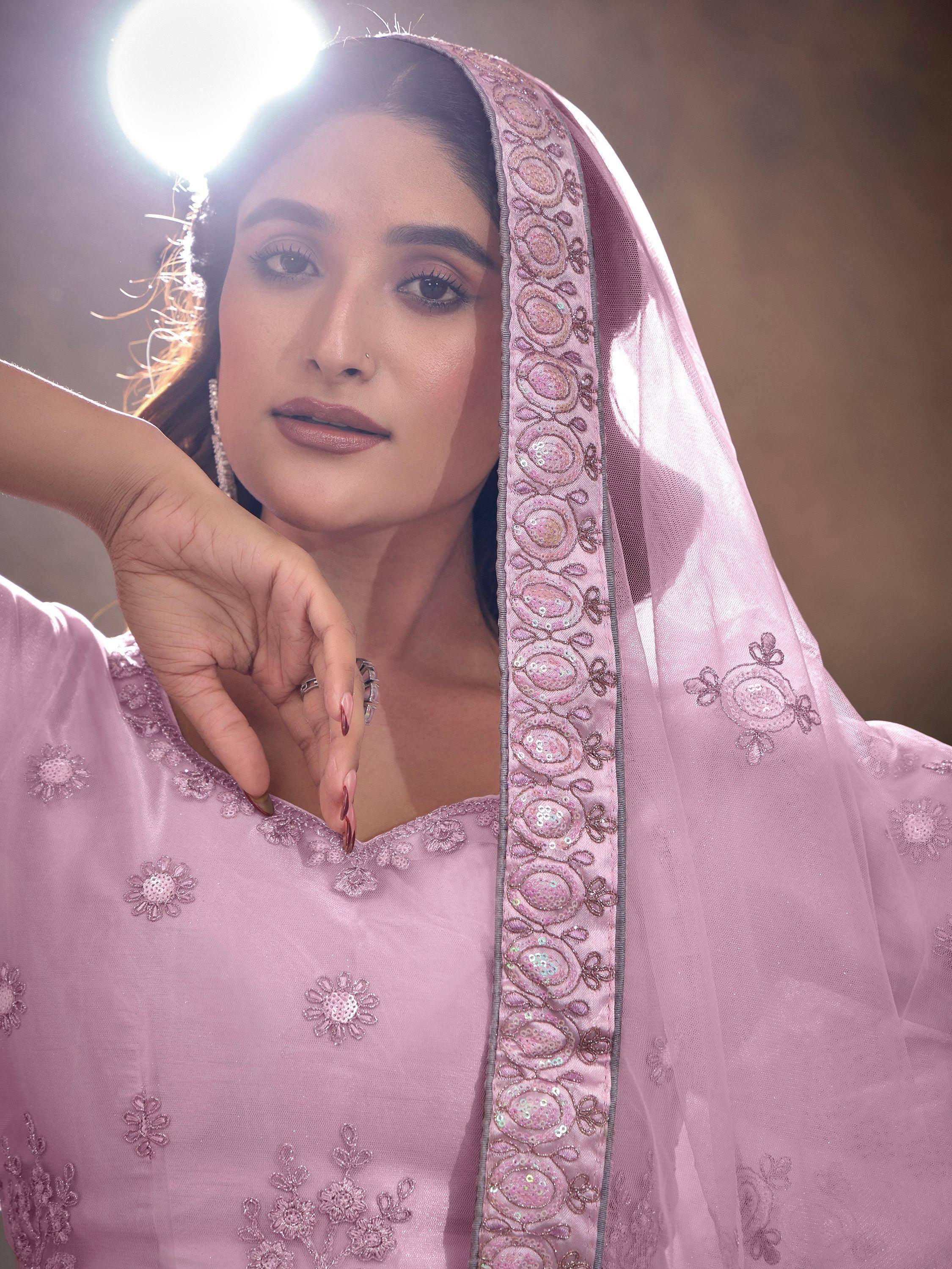 Elegant pink ethnic wear with floral embroidery and sequin dupatta, perfect for Indian celebrations.