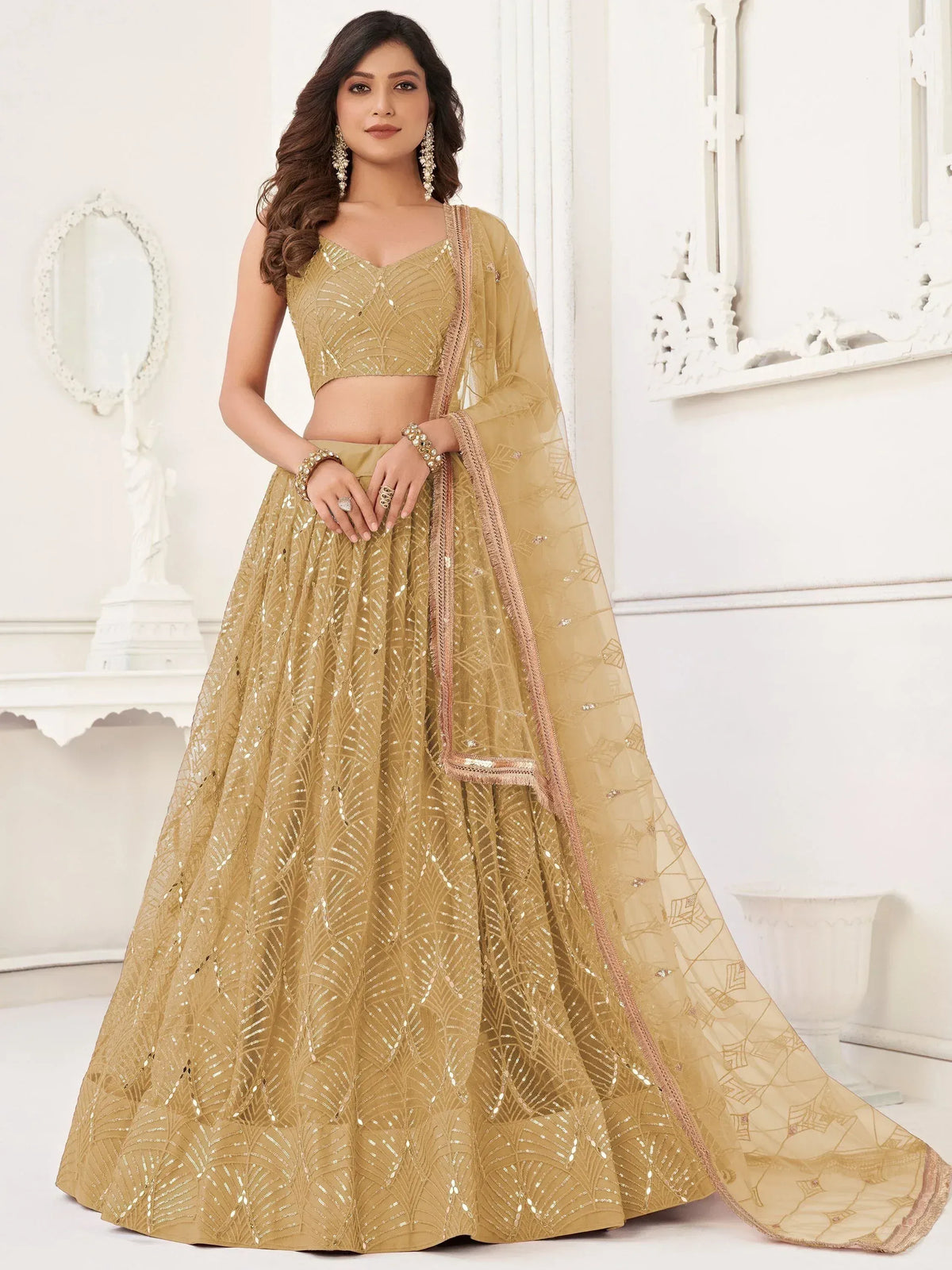 Golden designer lehenga choli with sequin work, perfect for Indian weddings and festive occasions