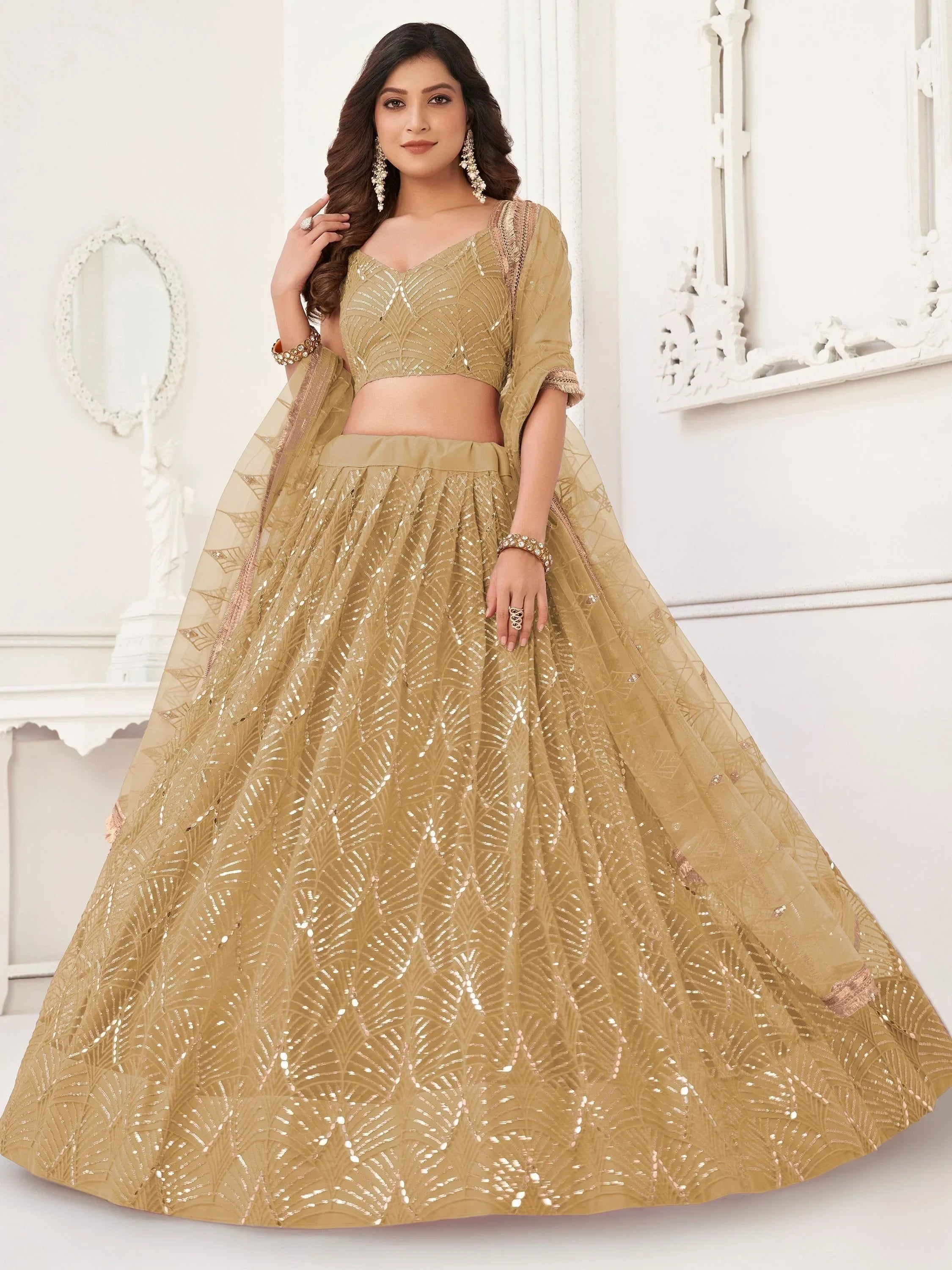 Gold sequin lehenga choli with leaf pattern, perfect for Indian weddings and festive occasions