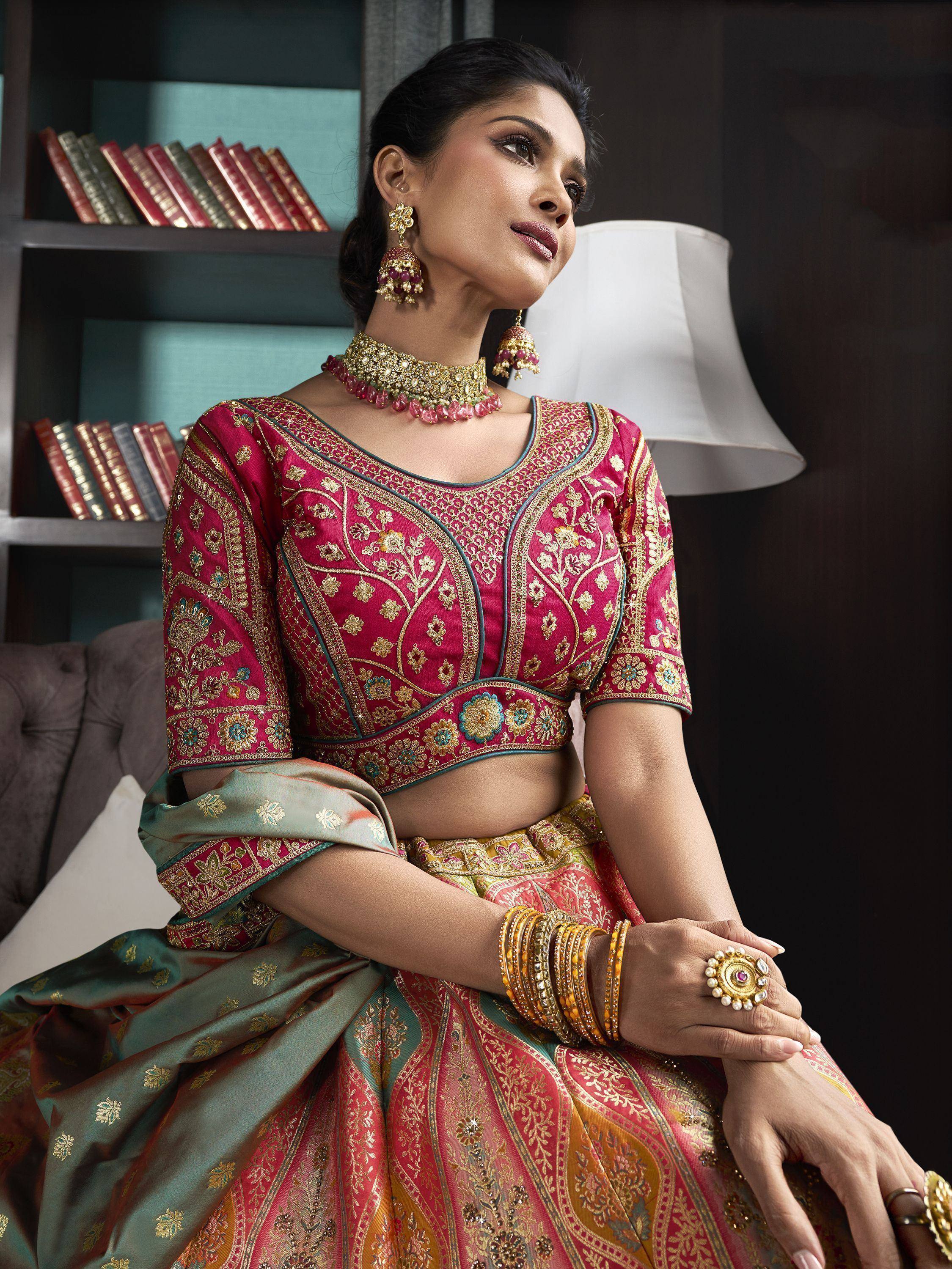 Elegant woman in designer lehenga choli with gold embroidery, perfect for Indian ethnic wear occasions.