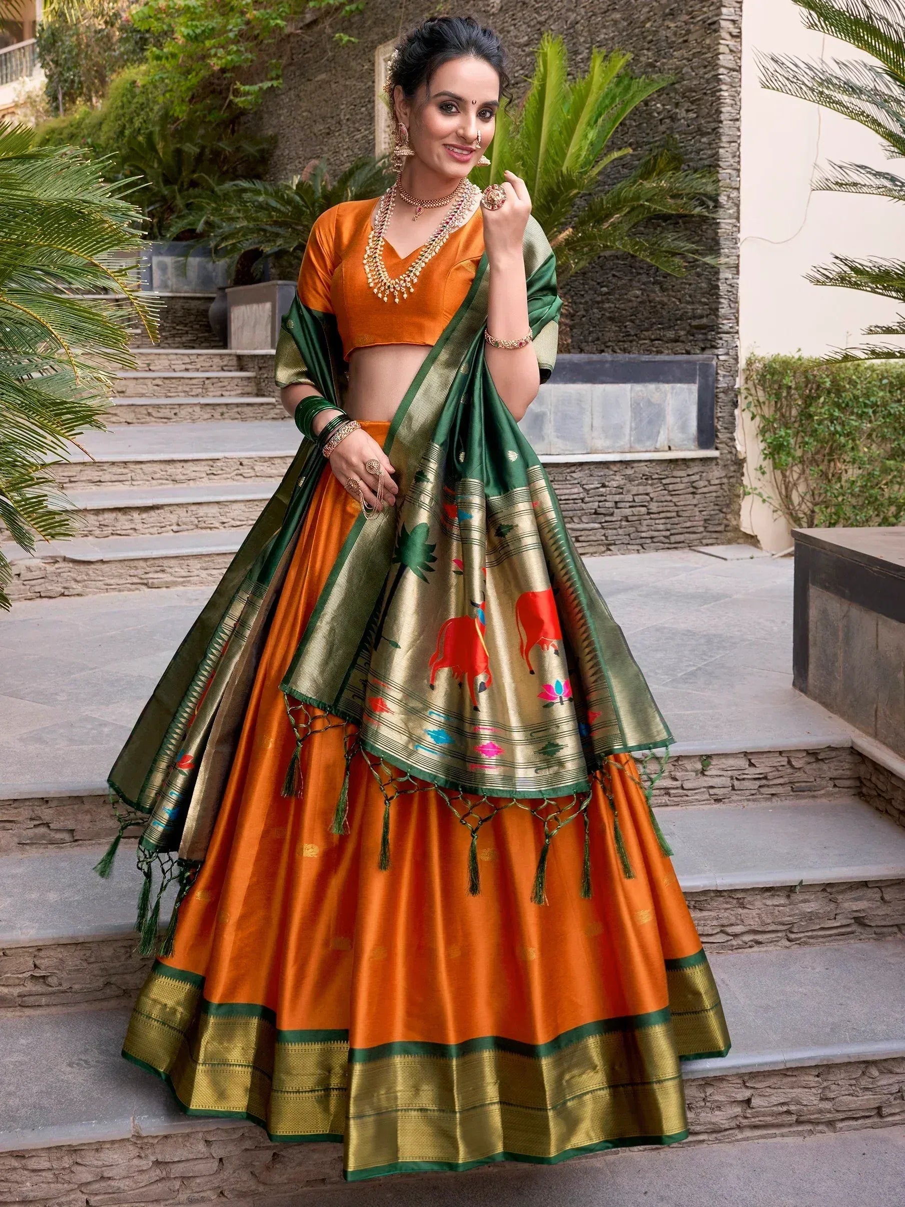 Orange and green designer lehenga choli with printed dupatta, perfect for Indian ethnic wear occasions