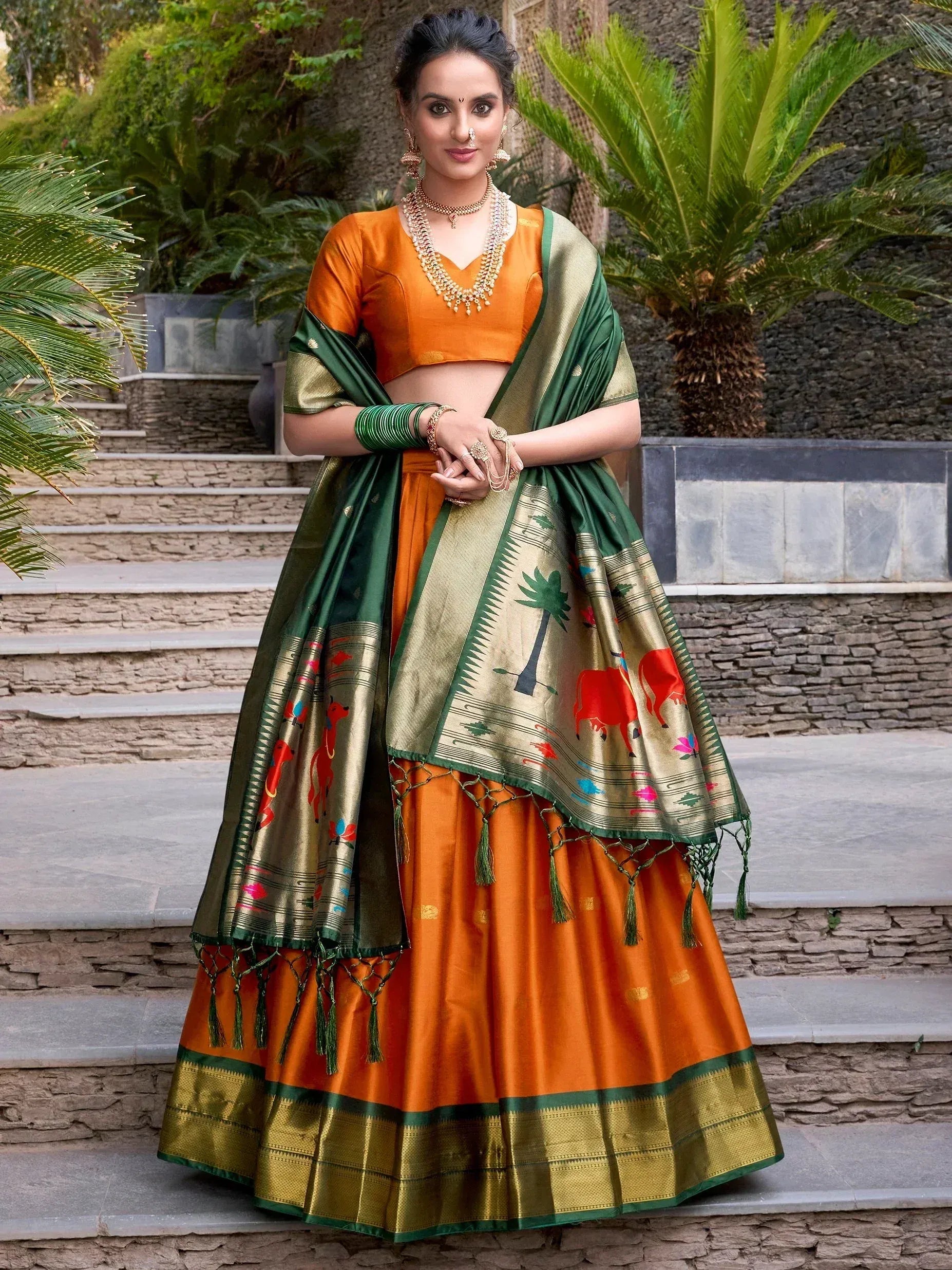 Orange and green designer lehenga choli with printed dupatta, perfect for Indian ethnic wear occasions