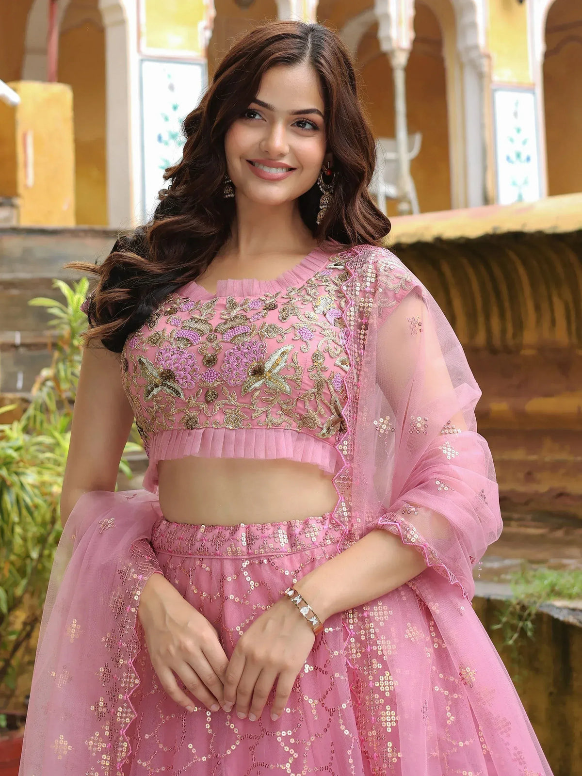 Pink embroidered lehenga choli with floral detailing and sheer dupatta, perfect for Indian ethnic occasions