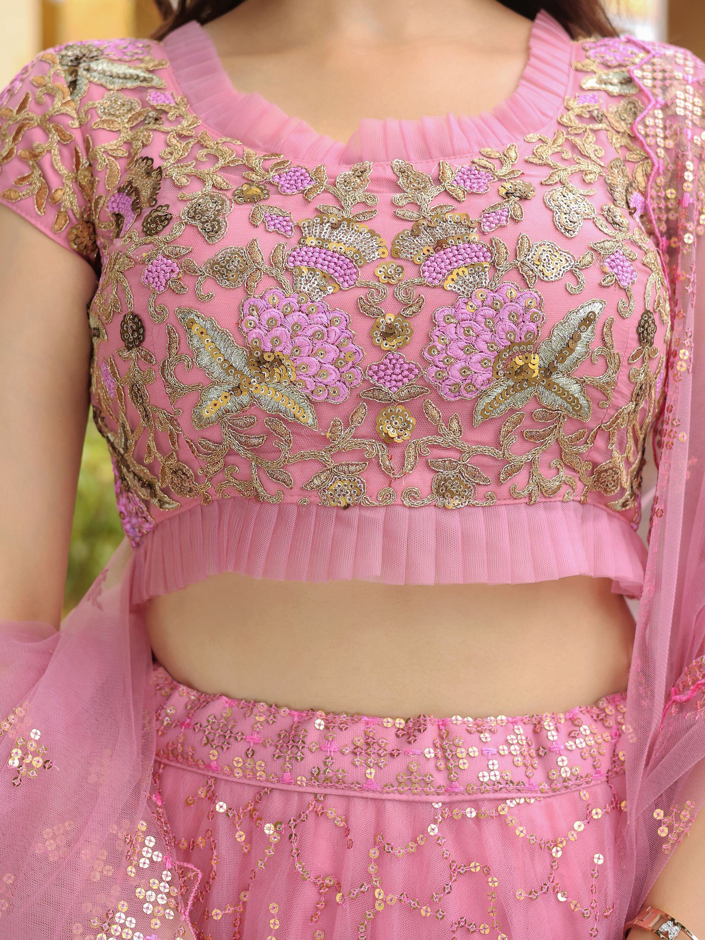 Pink embroidered lehenga choli with gold floral work and sequins, perfect for Indian ethnic wear