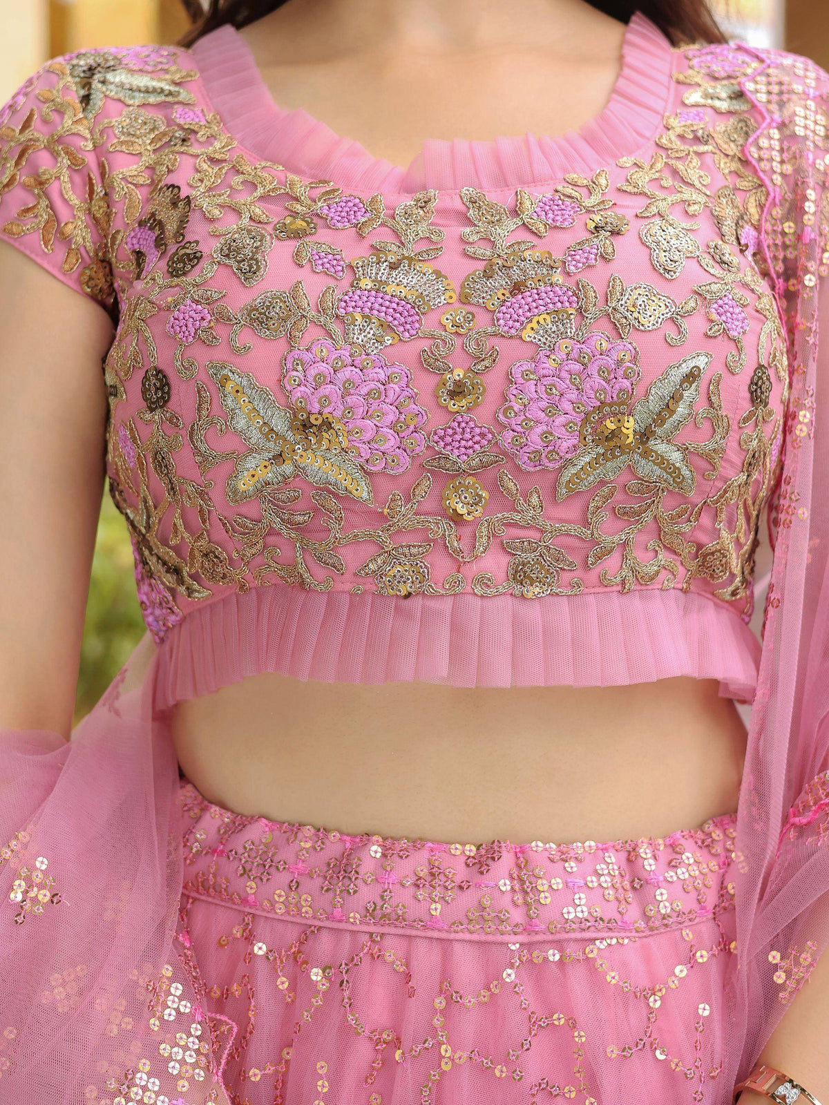 Pink embroidered lehenga choli with gold floral work and sequins, perfect for Indian ethnic wear