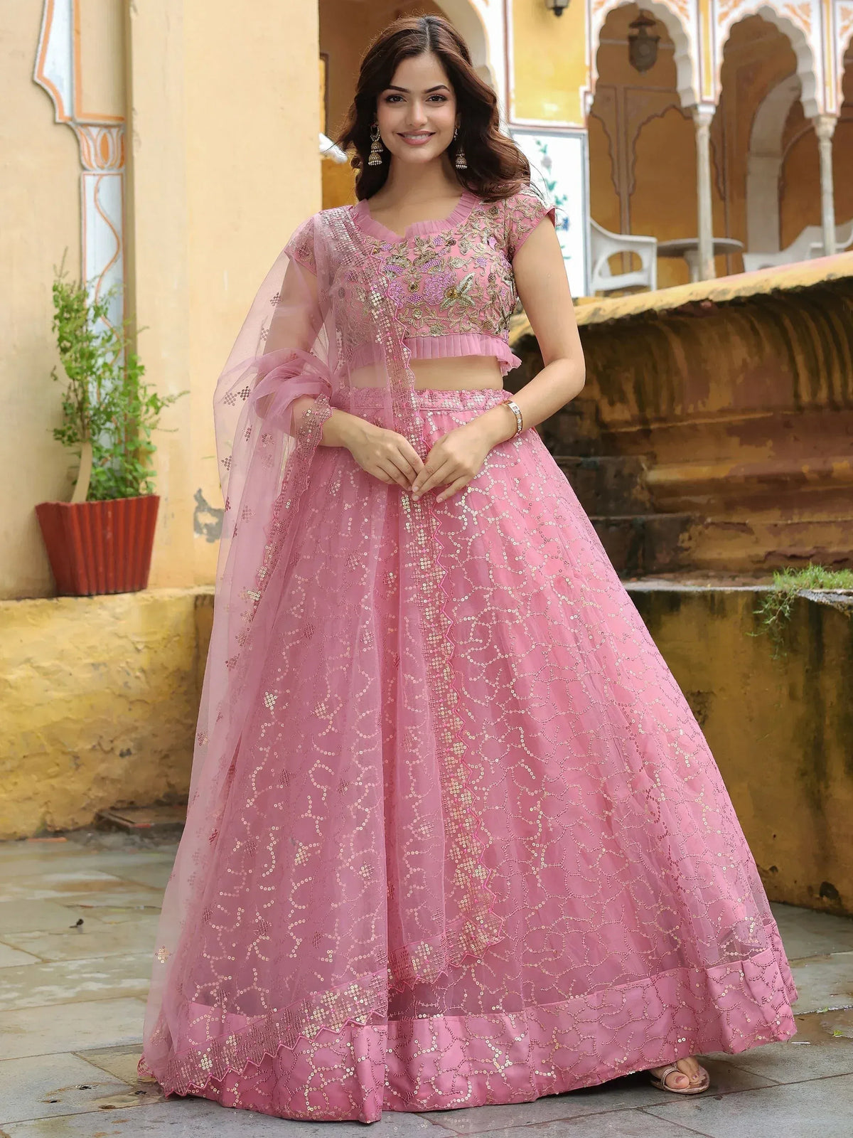 Pink embroidered lehenga choli with sequins, perfect for Indian ethnic wear and festive occasions.