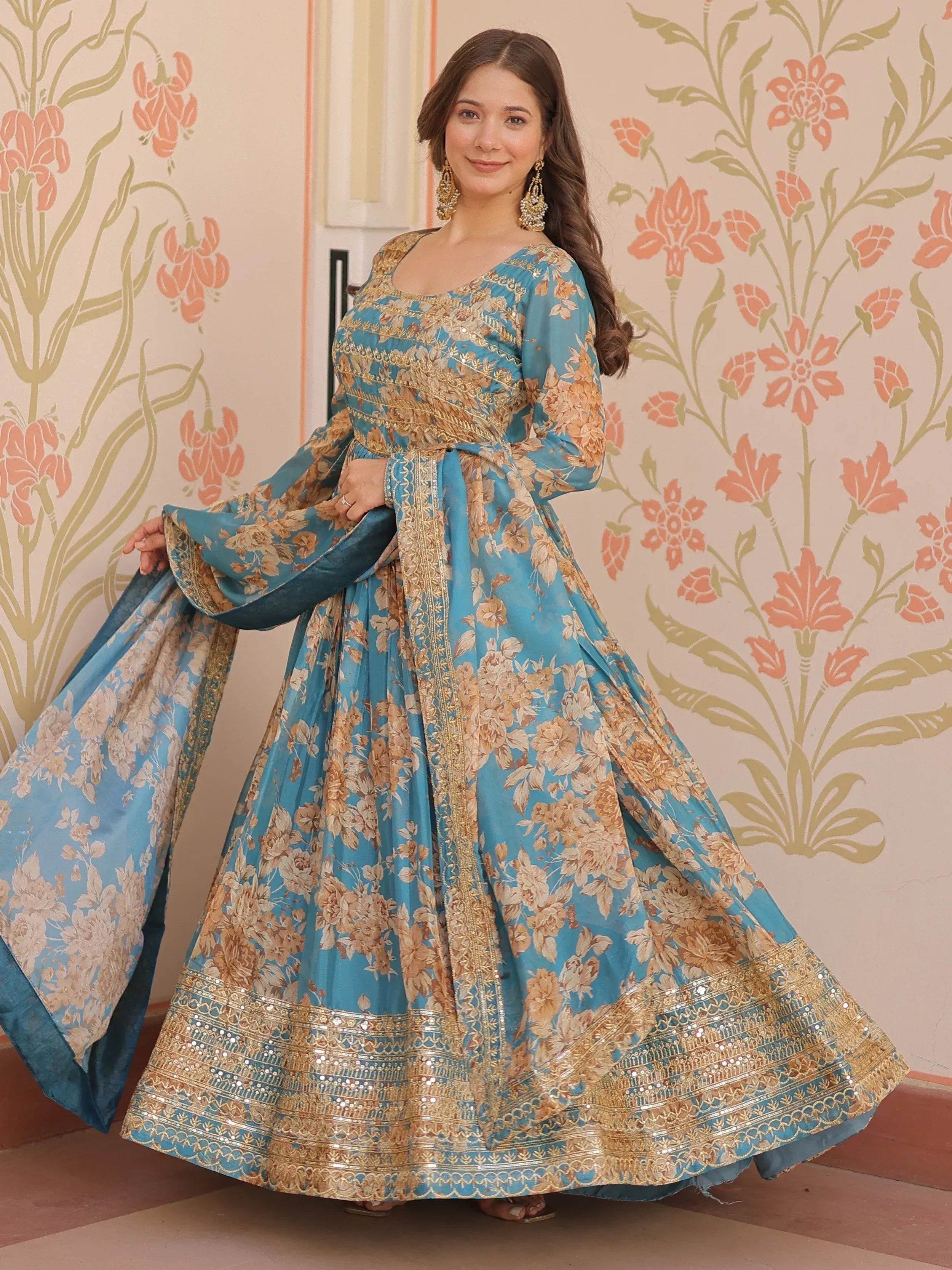 Blue floral ethnic gown with gold embroidery, perfect for Indian weddings and festive occasions