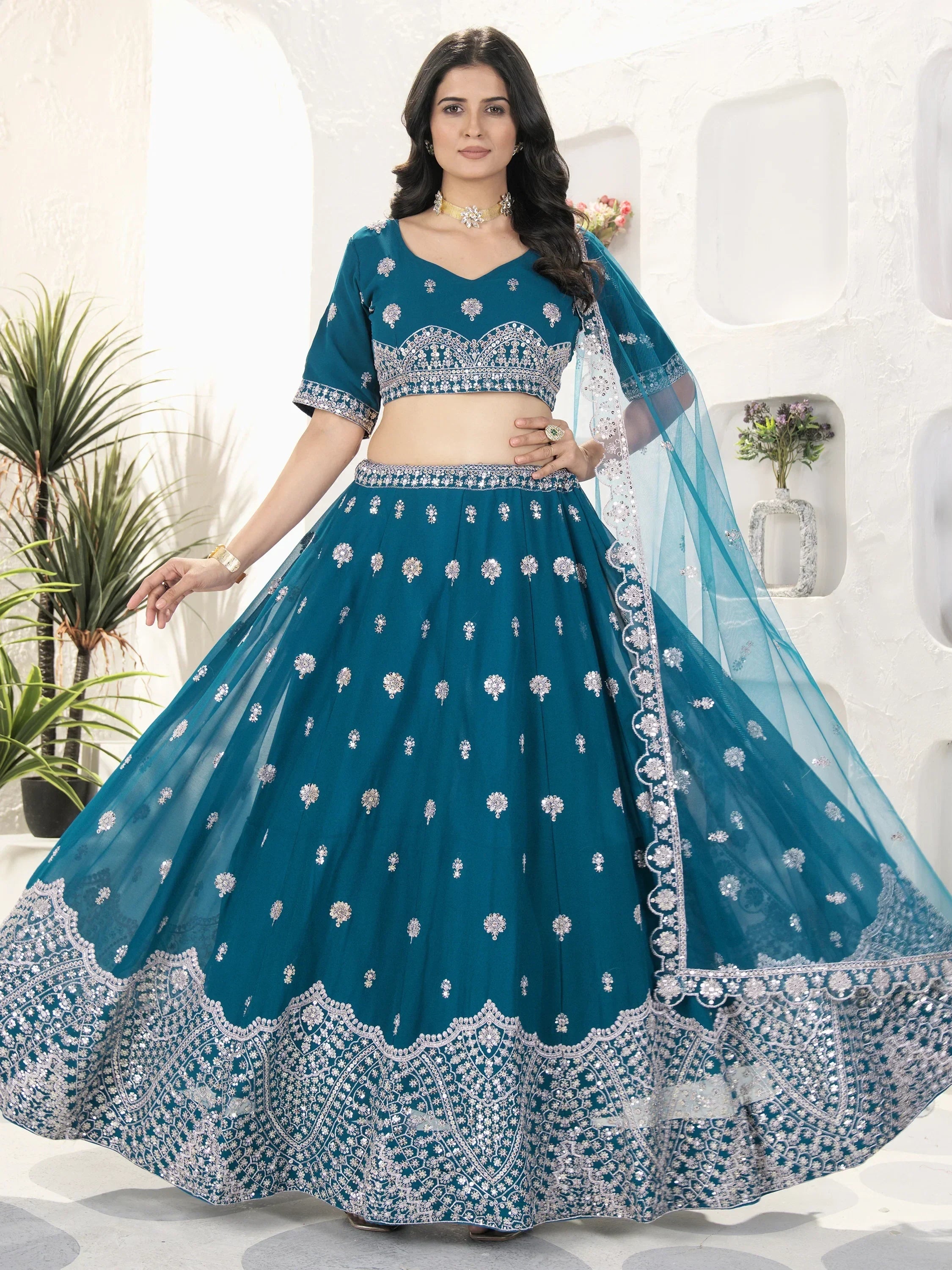 Teal blue designer lehenga choli with silver embroidery, perfect for weddings and festive occasions