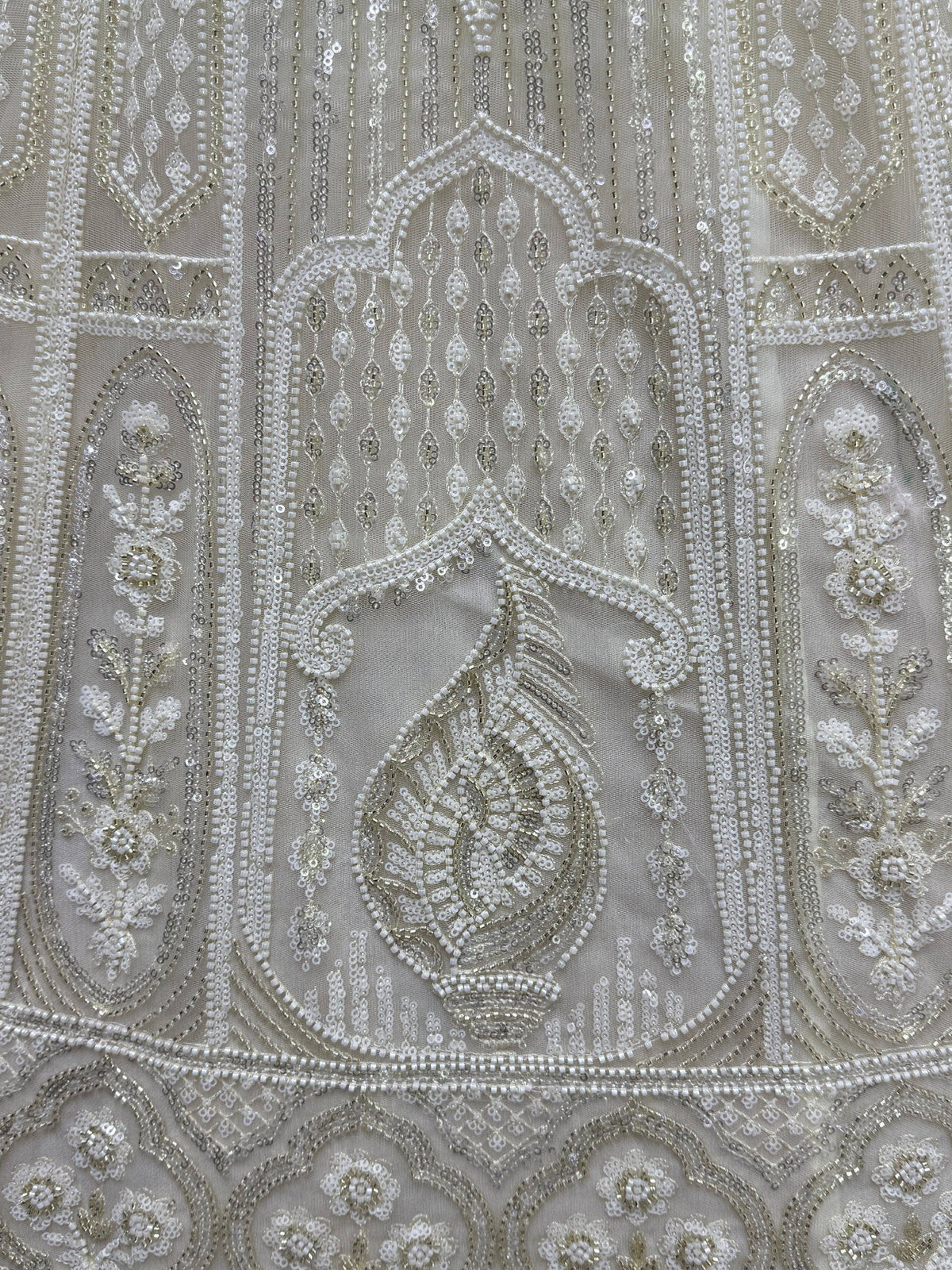 Elegant ivory ethnic wear with intricate beadwork and sequin embroidery for weddings and festivals