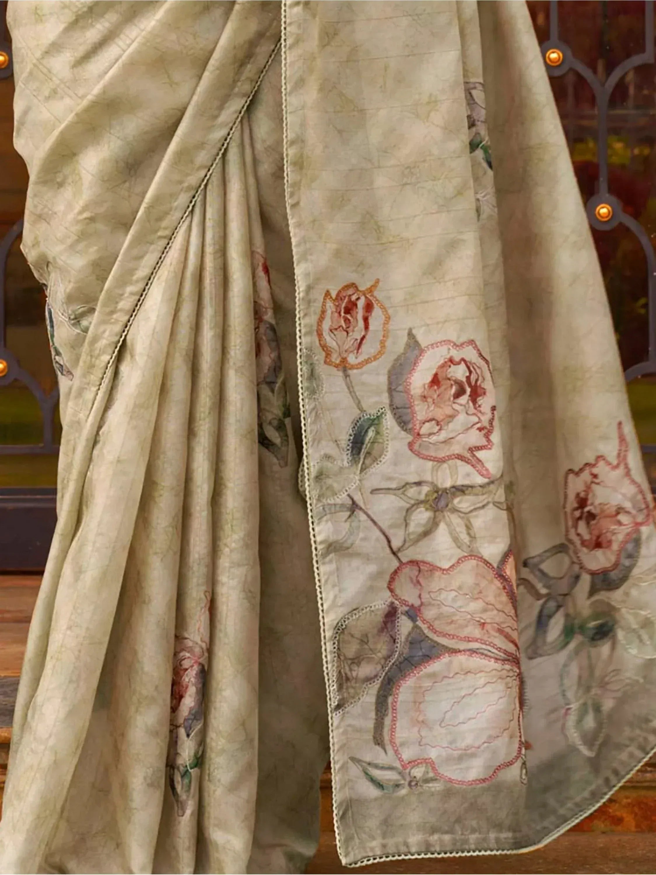 Beige saree with floral embroidery, perfect for Indian ethnic wear occasions.