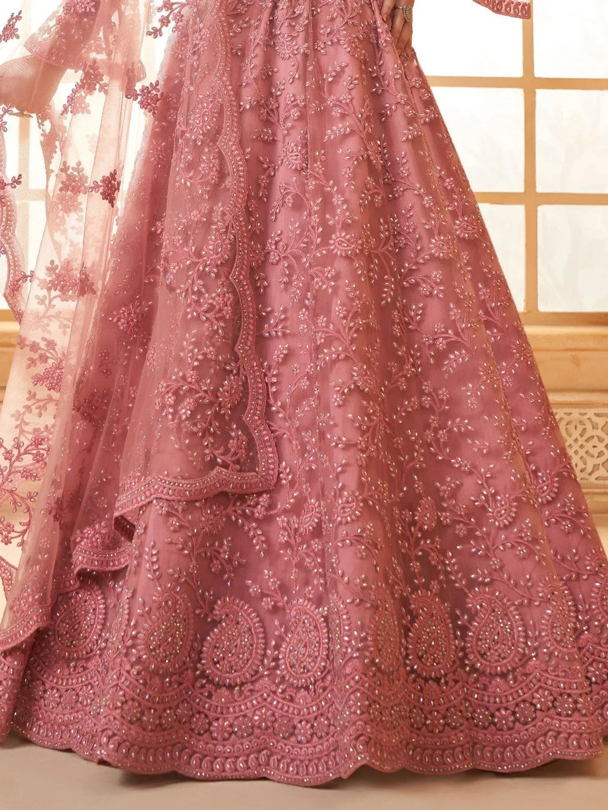 Pink embroidered lehenga with floral beadwork and sheer dupatta, perfect for Indian weddings and festive occasions