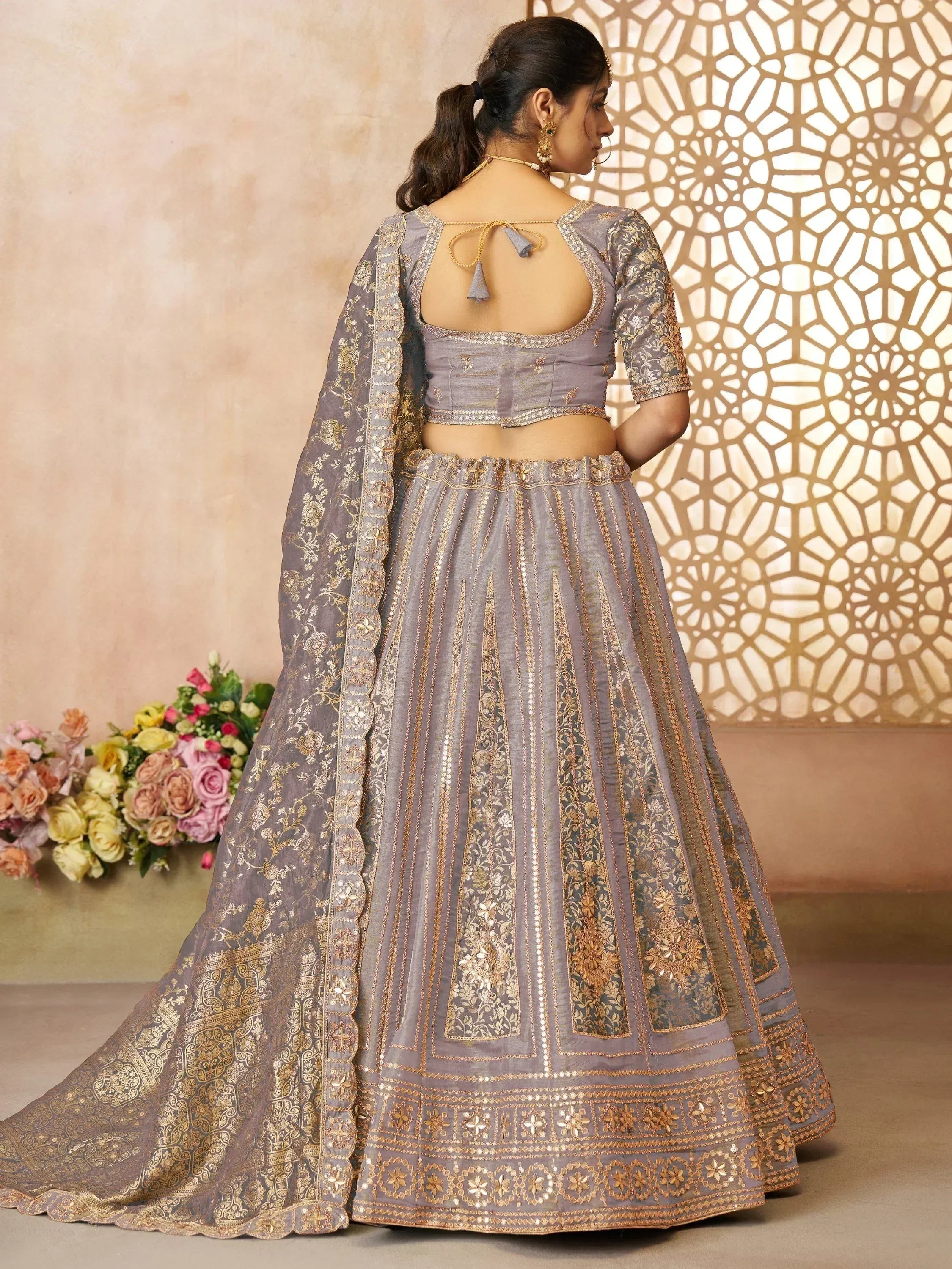 Grey designer lehenga choli with gold embroidery and back tie blouse, perfect for Indian weddings