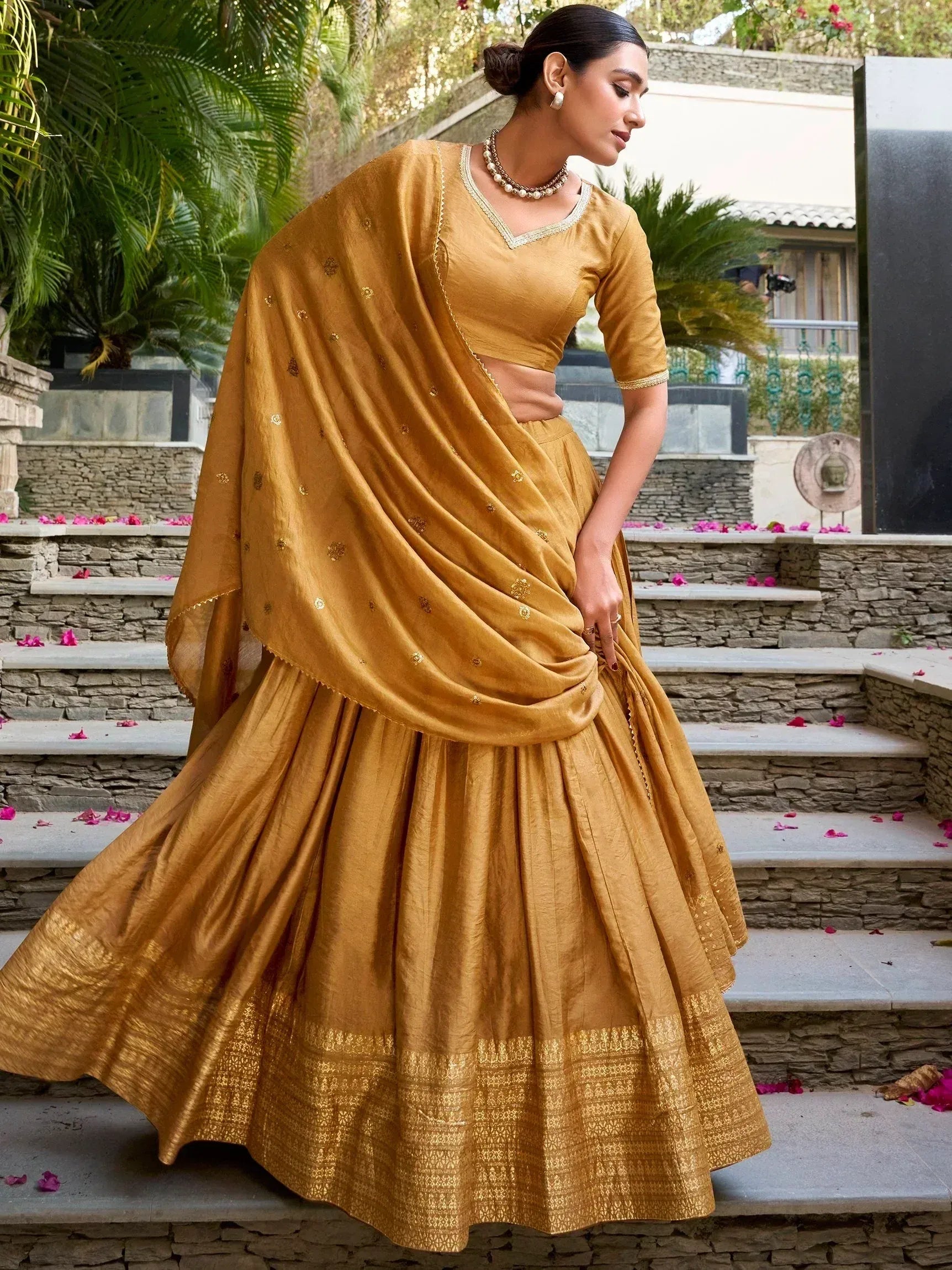 Mustard yellow designer lehenga choli with gold embroidery, perfect for Indian ethnic wear occasions