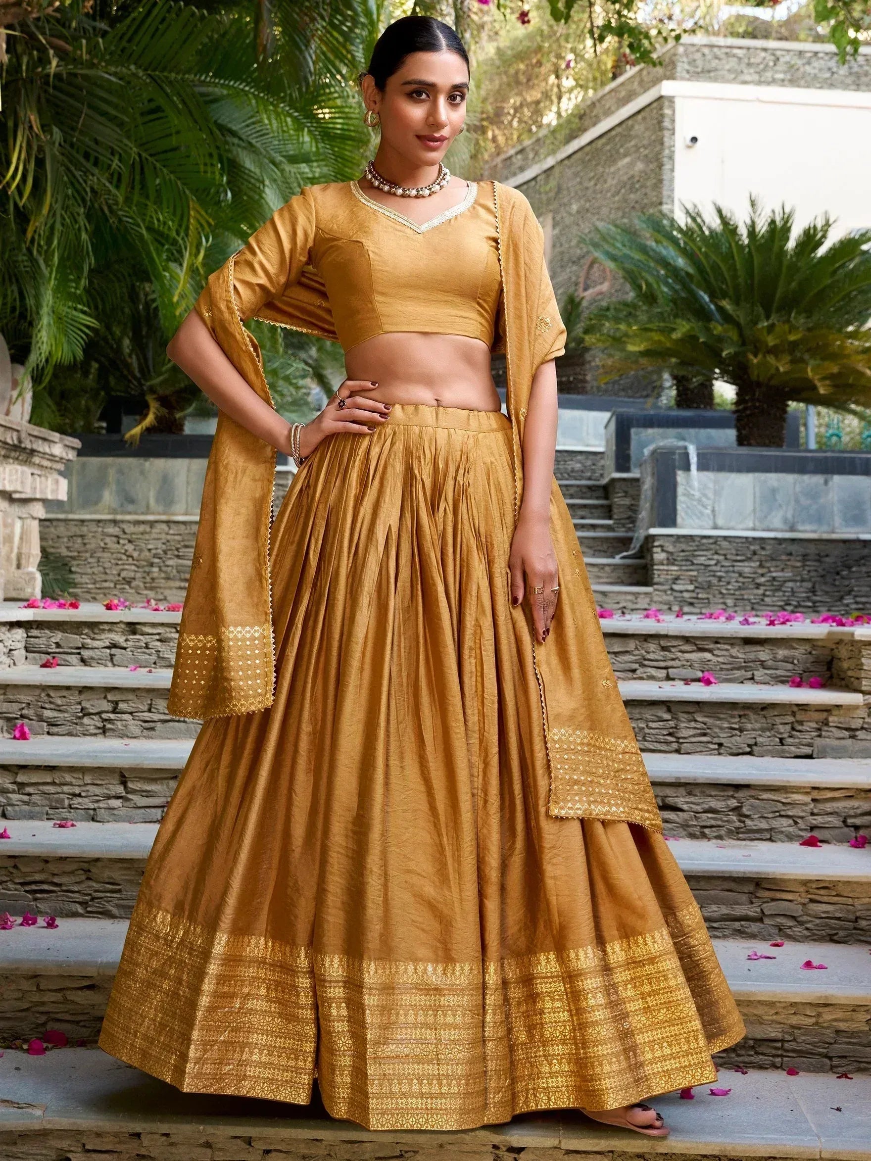 Mustard yellow designer lehenga choli with gold embroidery, perfect for Indian ethnic wear occasions