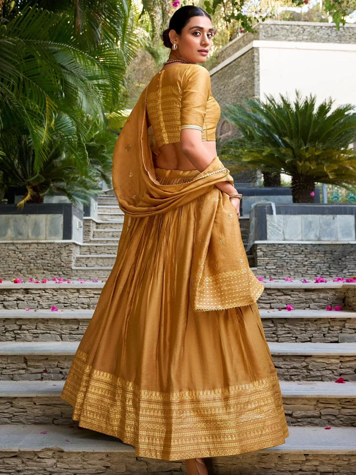 Mustard yellow lehenga choli with gold embroidery, perfect for Indian ethnic occasions and weddings