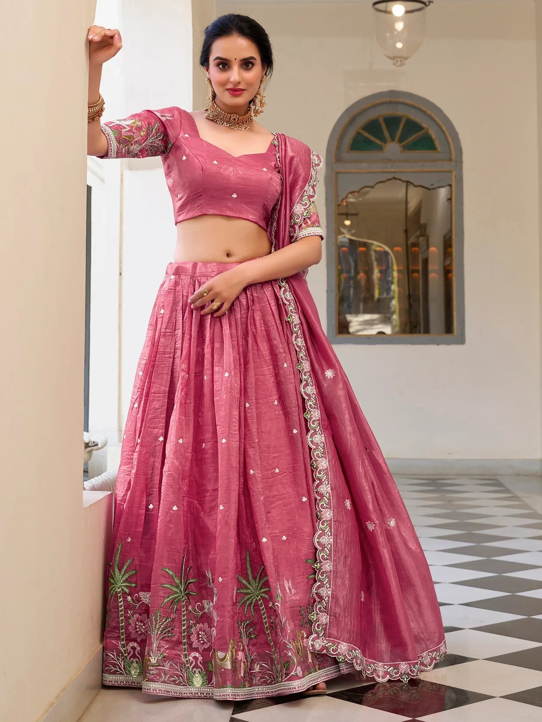 Pink embroidered lehenga choli with palm tree motifs, perfect for Indian ethnic wear events