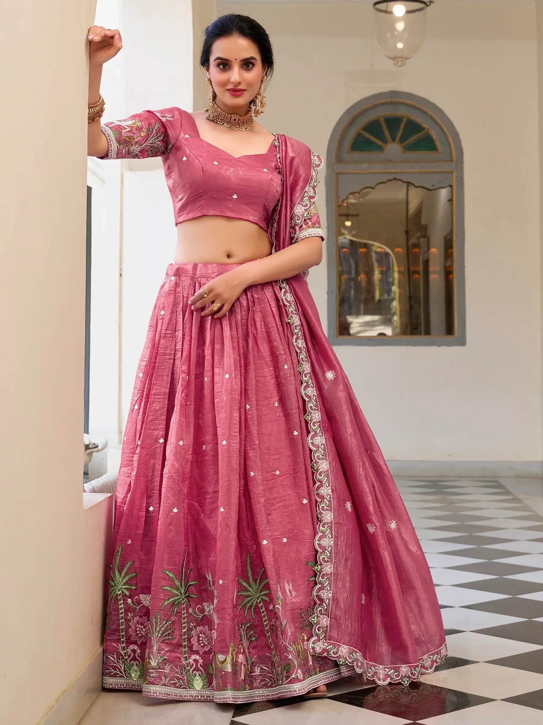 Pink embroidered lehenga choli with palm tree motifs, perfect for Indian ethnic wear events