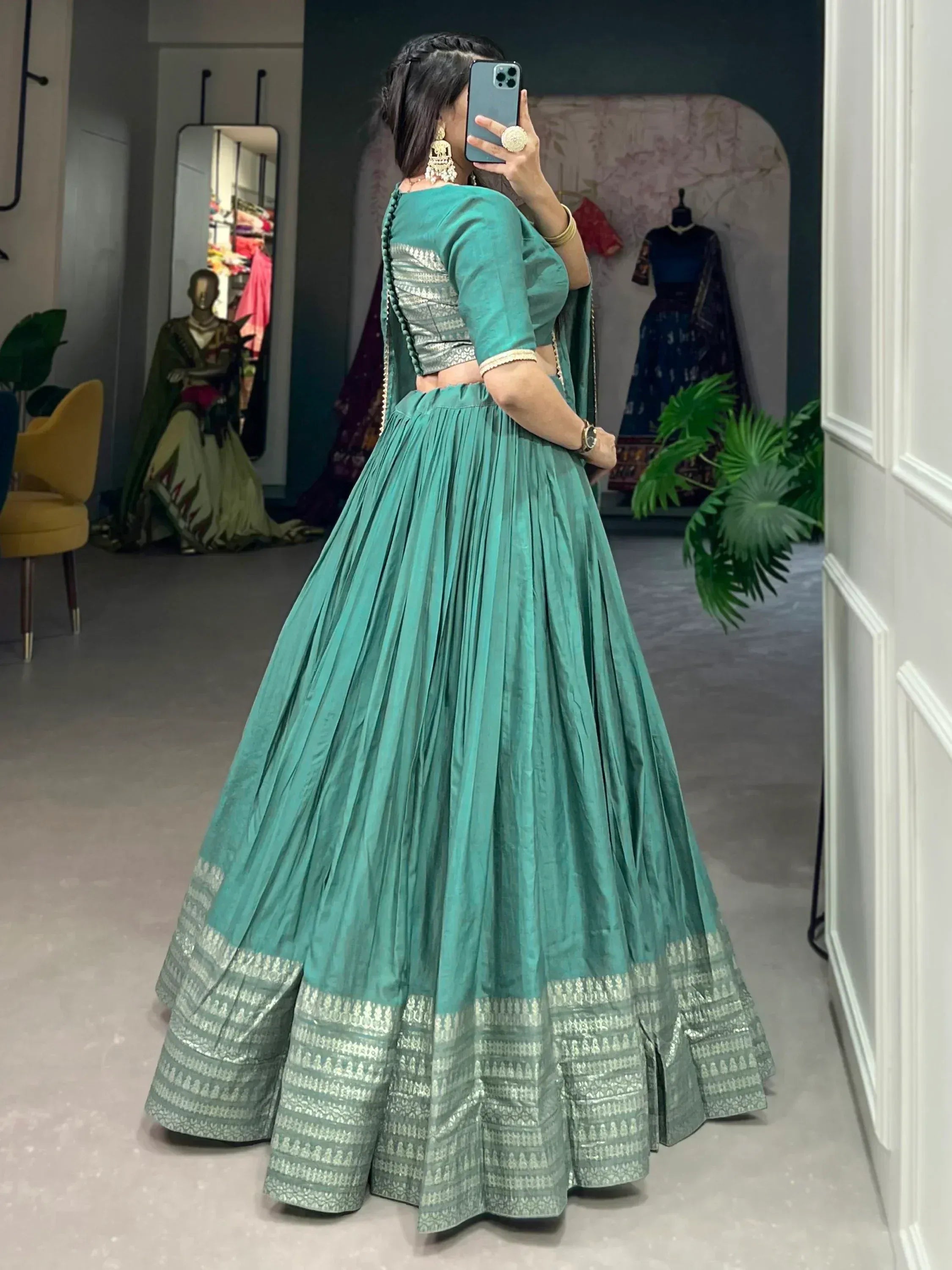Teal lehenga choli with silver embroidery, perfect for Indian ethnic wear and festive occasions.