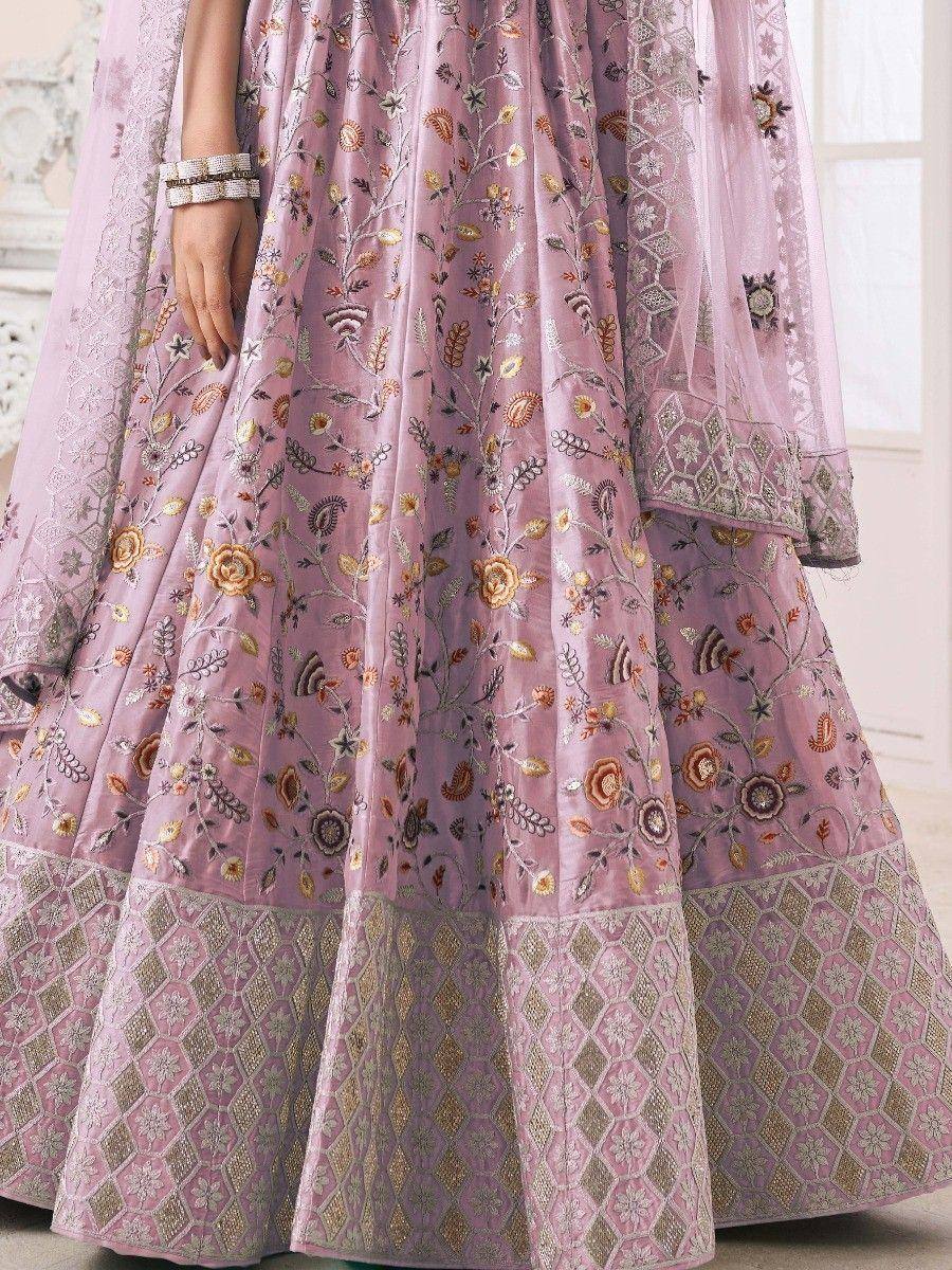 Pink embroidered lehenga choli with floral motifs and geometric border, perfect for Indian ethnic wear