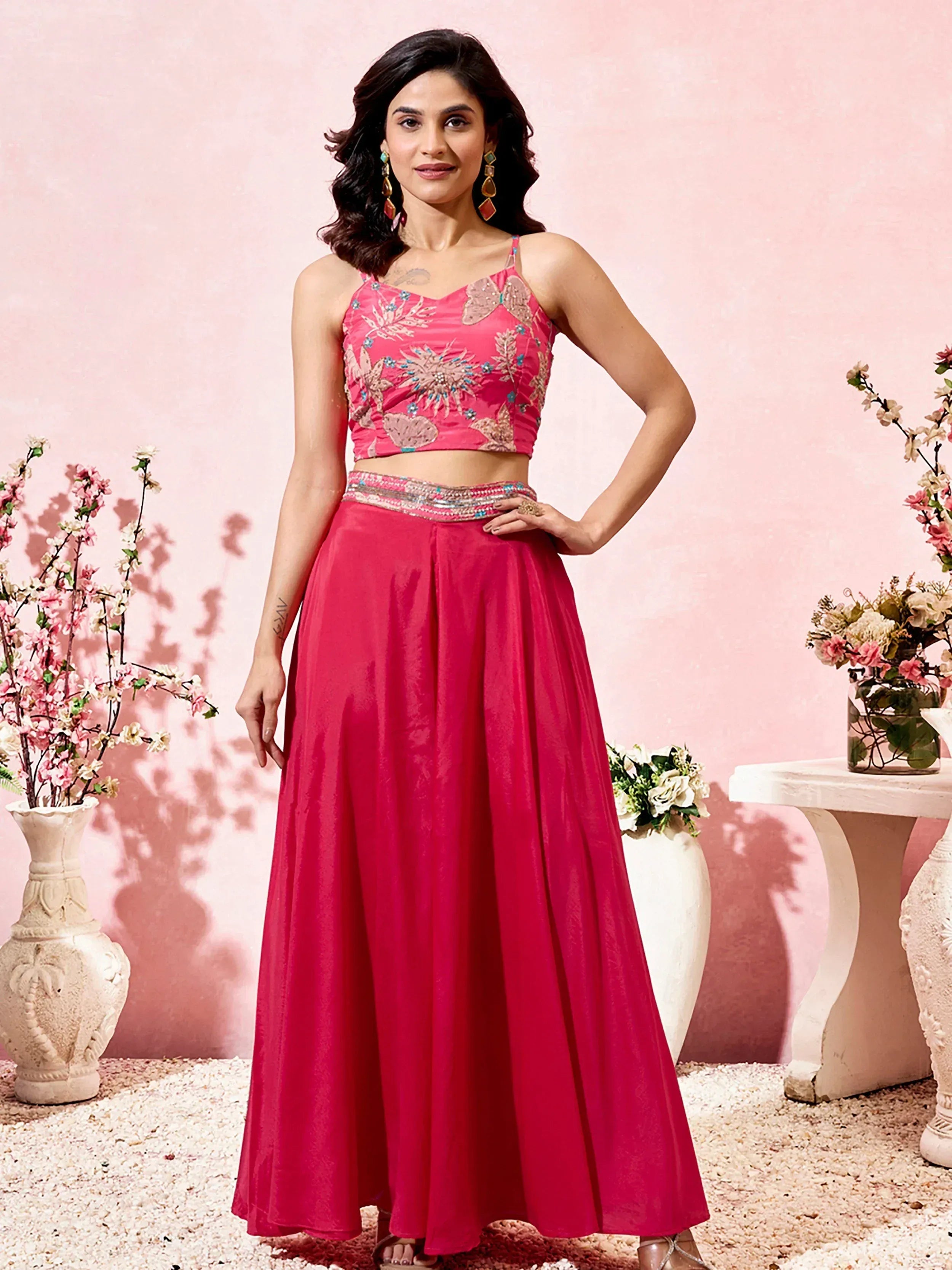Pink embroidered lehenga choli with floral motifs, perfect for Indian ethnic wear events
