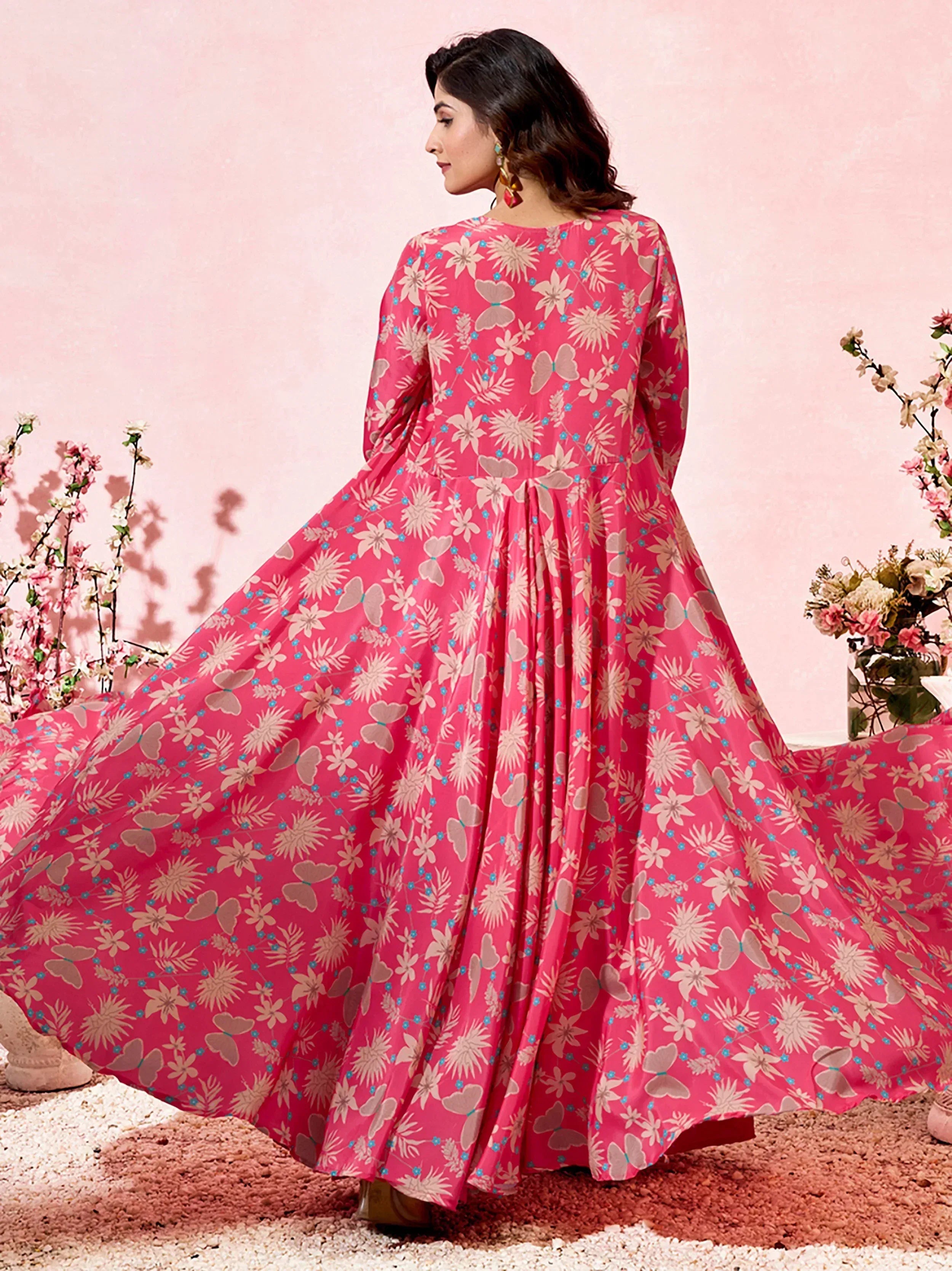Pink floral print ethnic gown with butterfly motifs, perfect for festive occasions