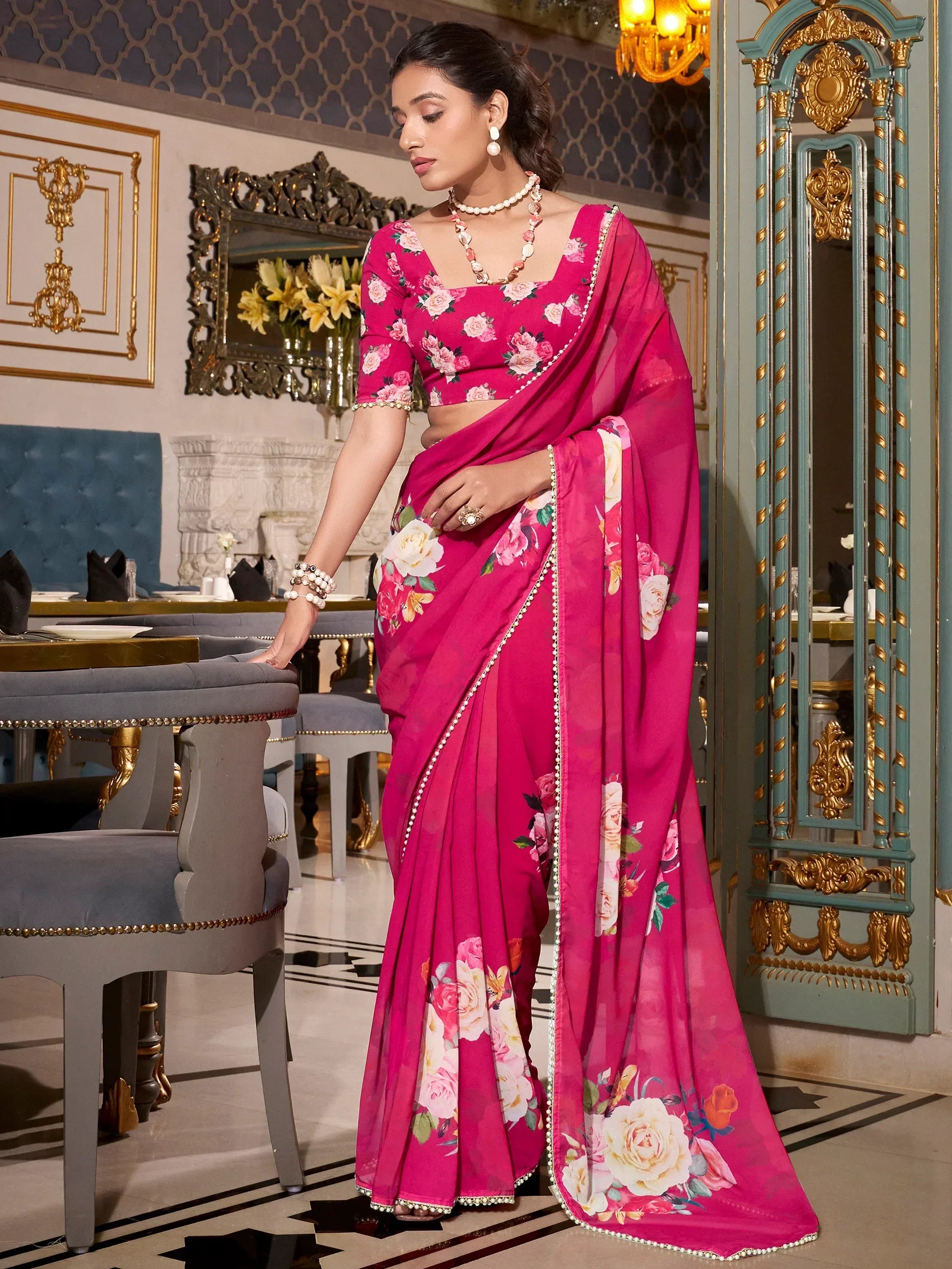 Pink floral print saree with pearl border, perfect for Indian ethnic occasions and designer events.