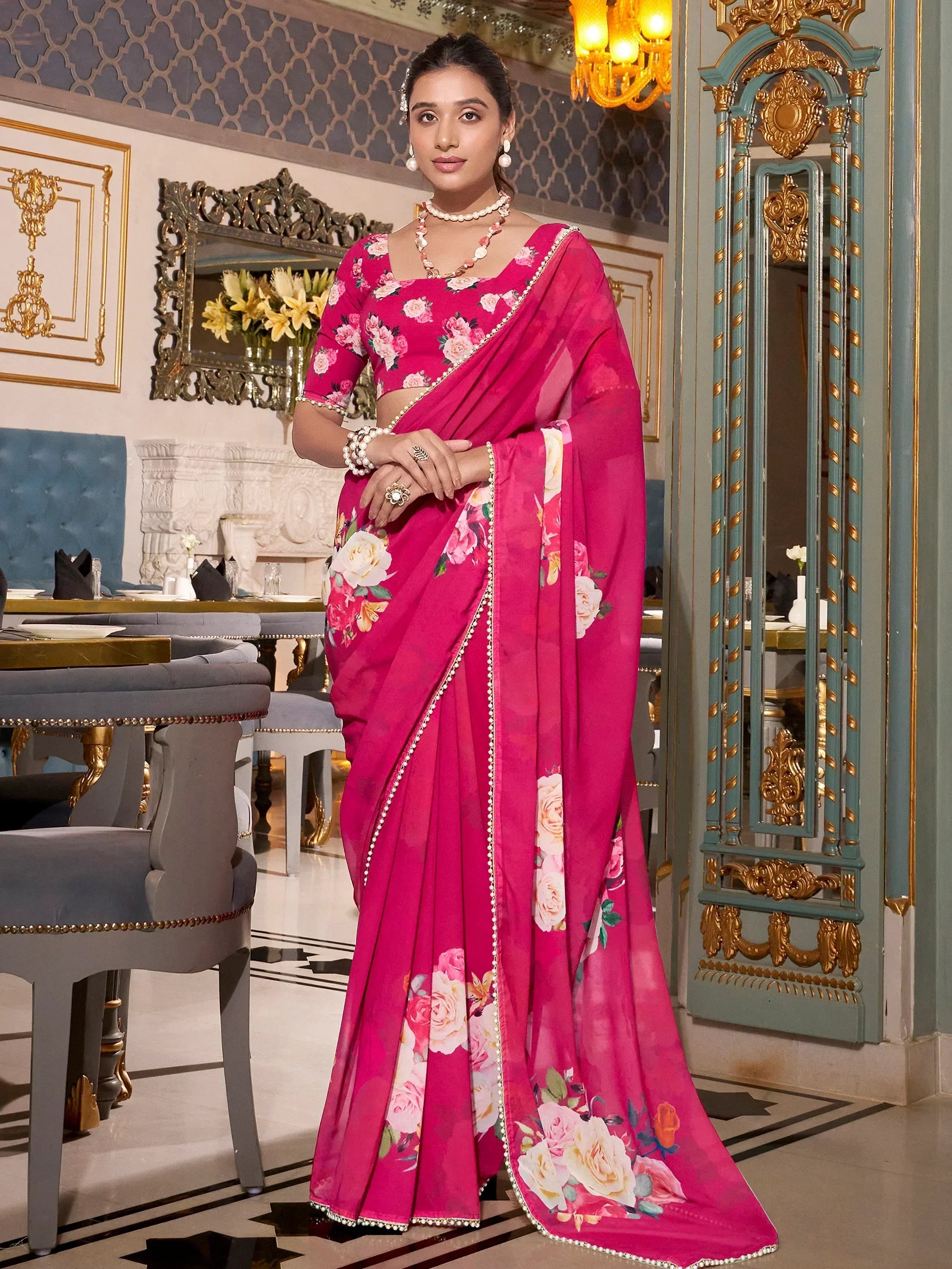 Pink floral printed saree with pearl border, perfect for Indian ethnic occasions and festive wear.