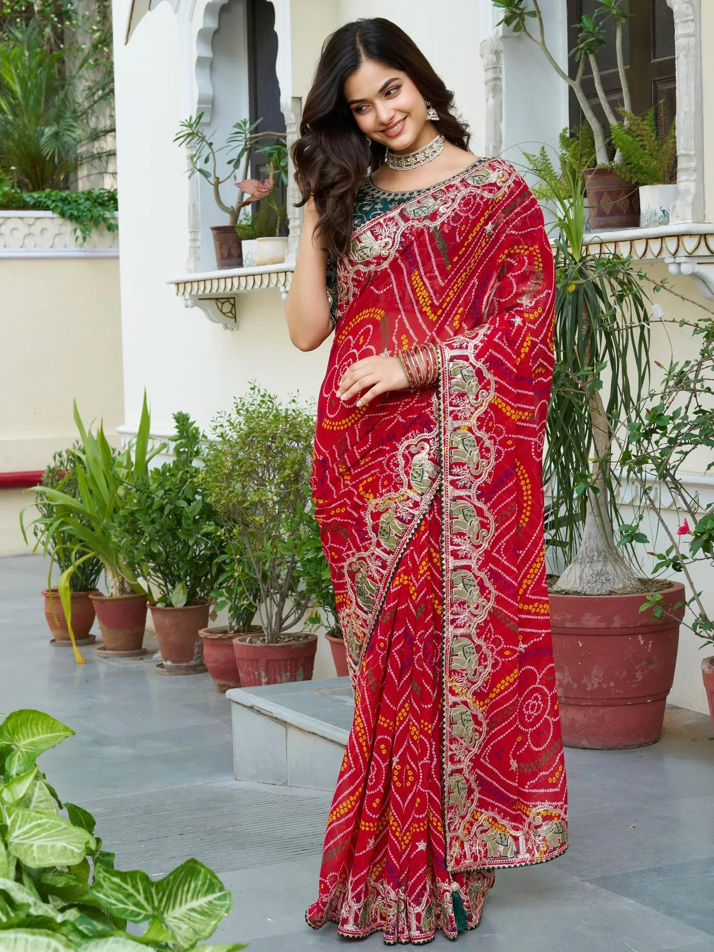 Red embroidered saree with elephant motifs, Indian ethnic wear for women