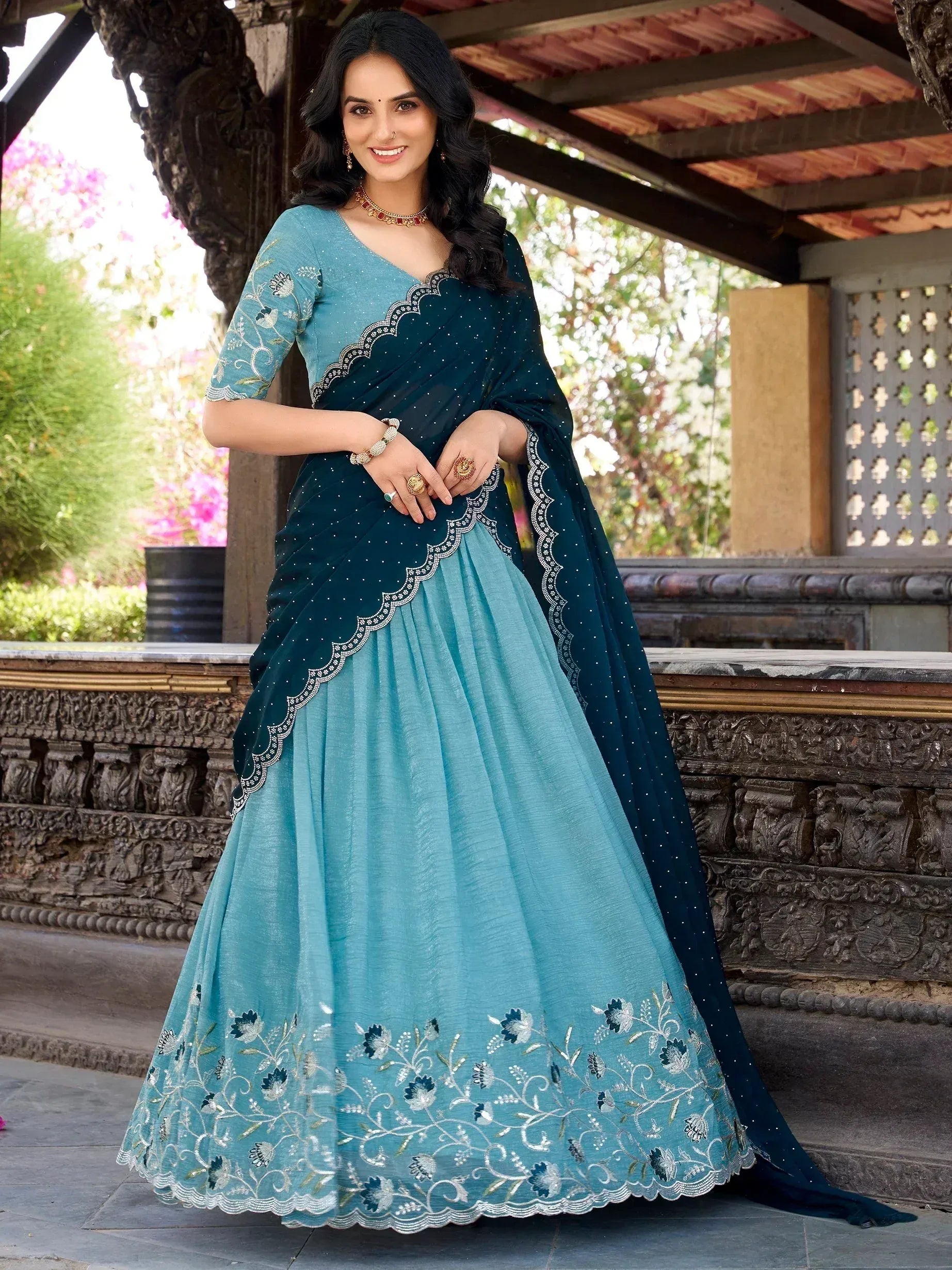 Teal and blue embroidered lehenga choli with floral detailing, perfect for Indian ethnic wear occasions