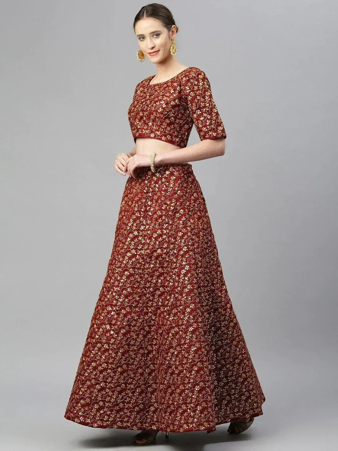 Maroon floral lehenga choli with gold embroidery, perfect for Indian ethnic wear occasions