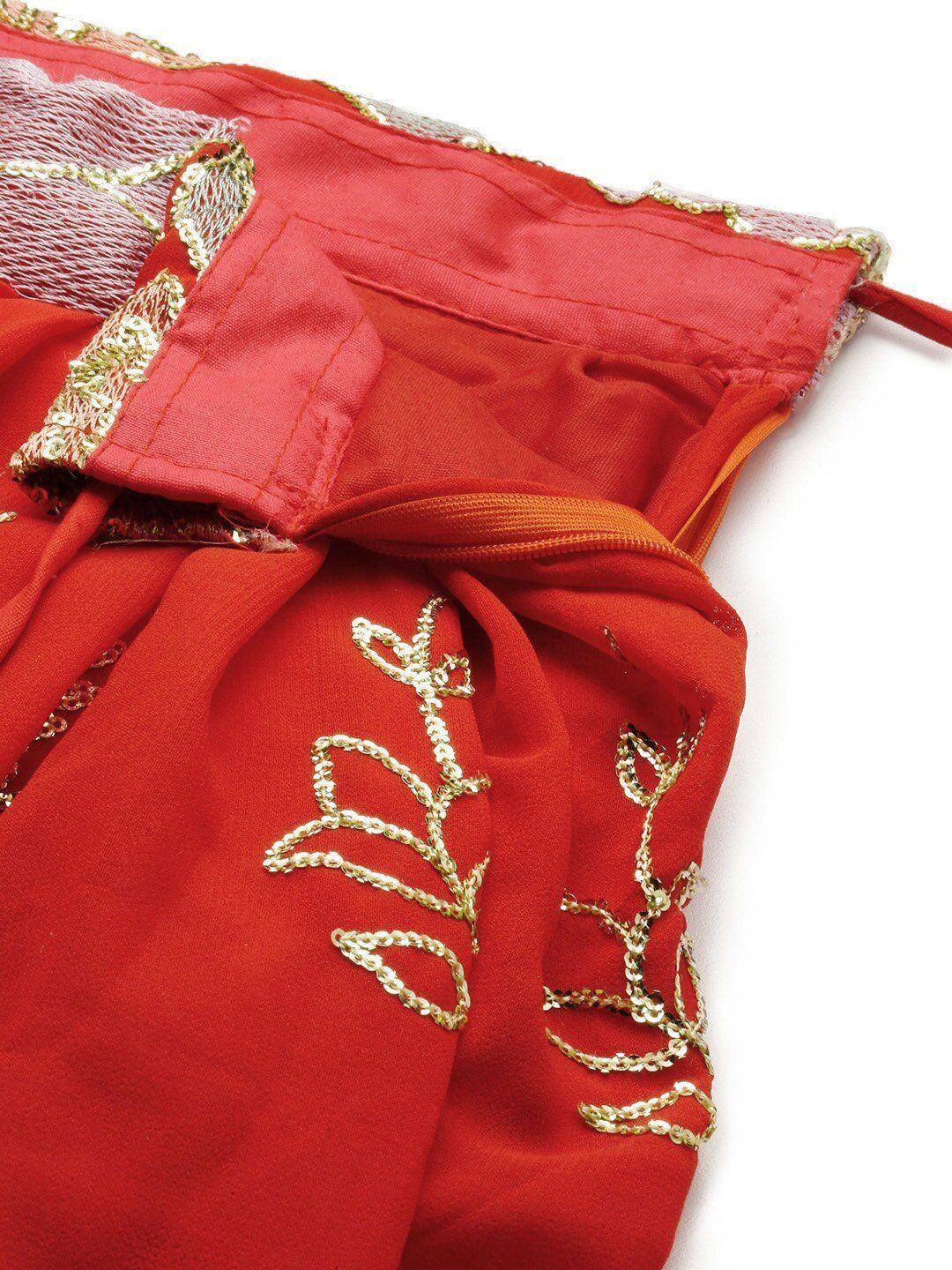 Red ethnic wear with gold sequin embroidery and lace trim, perfect for festive occasions.