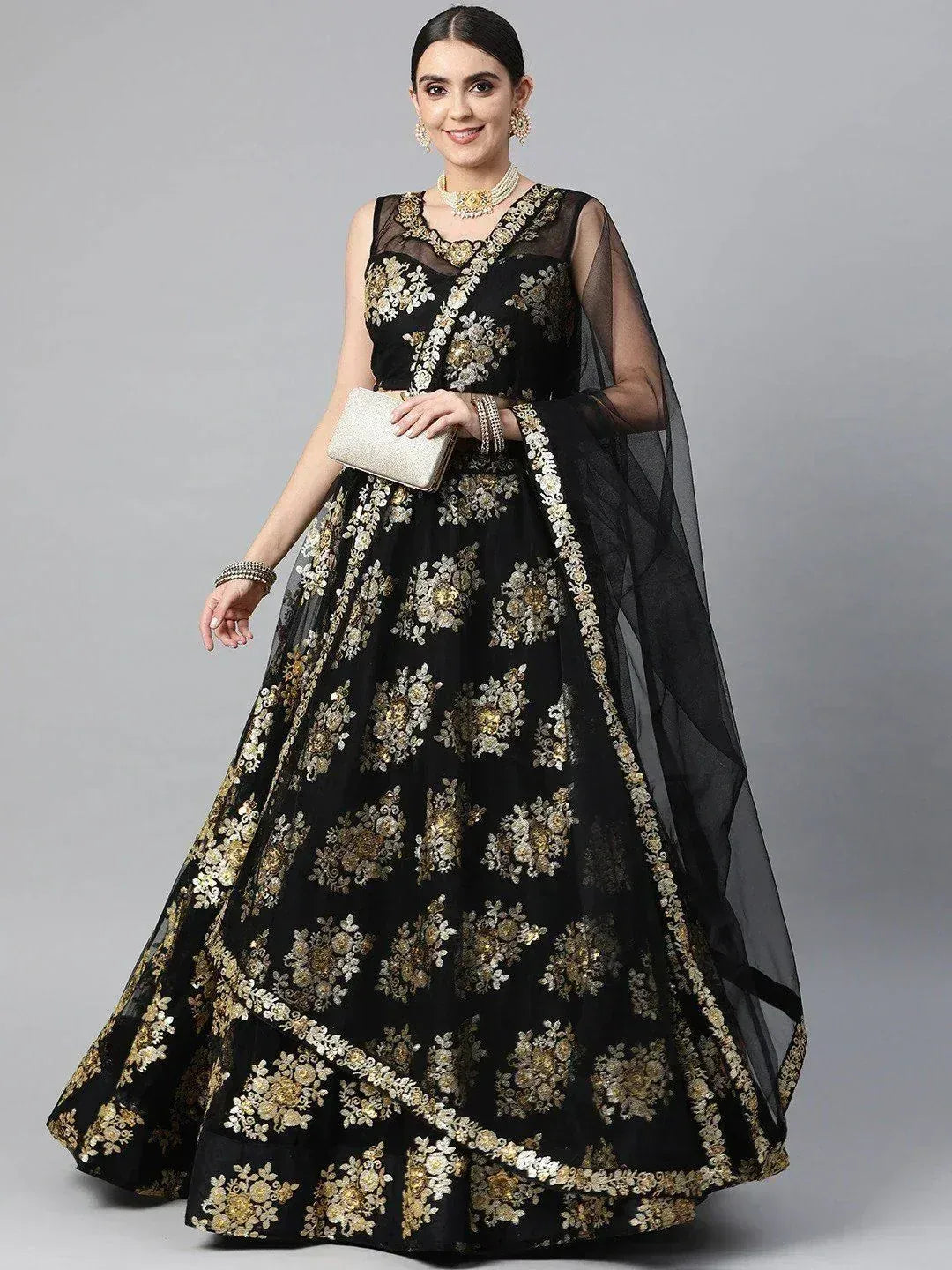 Black and gold embroidered lehenga choli with sheer dupatta, perfect for Indian ethnic wear occasions