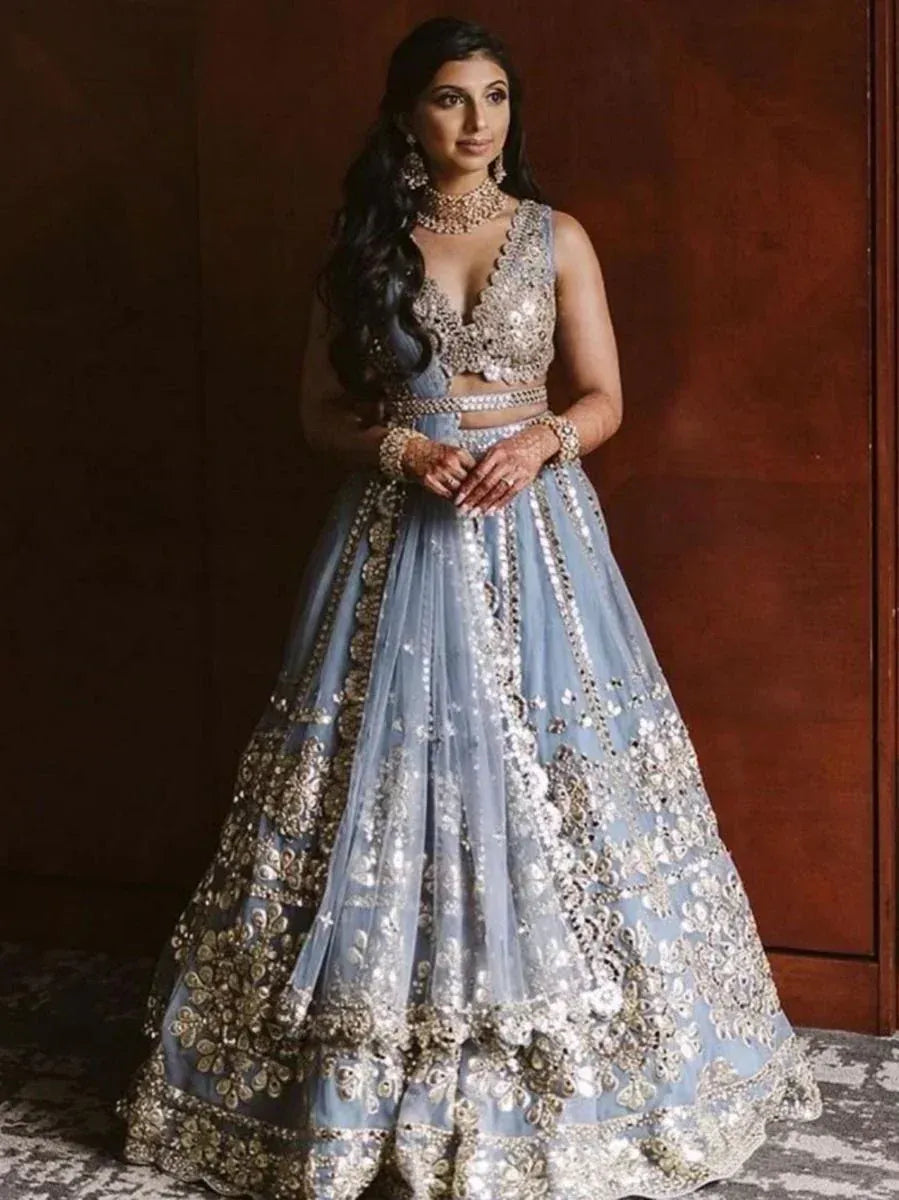 Elegant light blue designer lehenga choli with heavy silver embroidery and embellishments for weddings