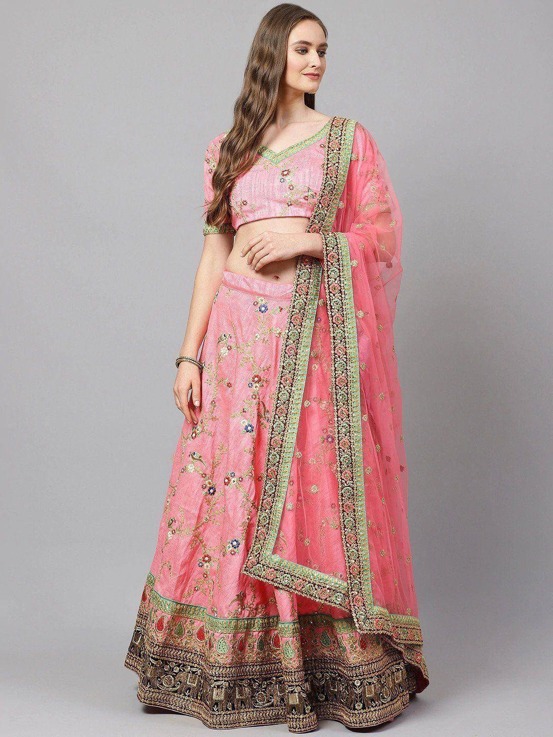 Pink embroidered lehenga choli with floral motifs and green border, ideal for Indian ethnic occasions