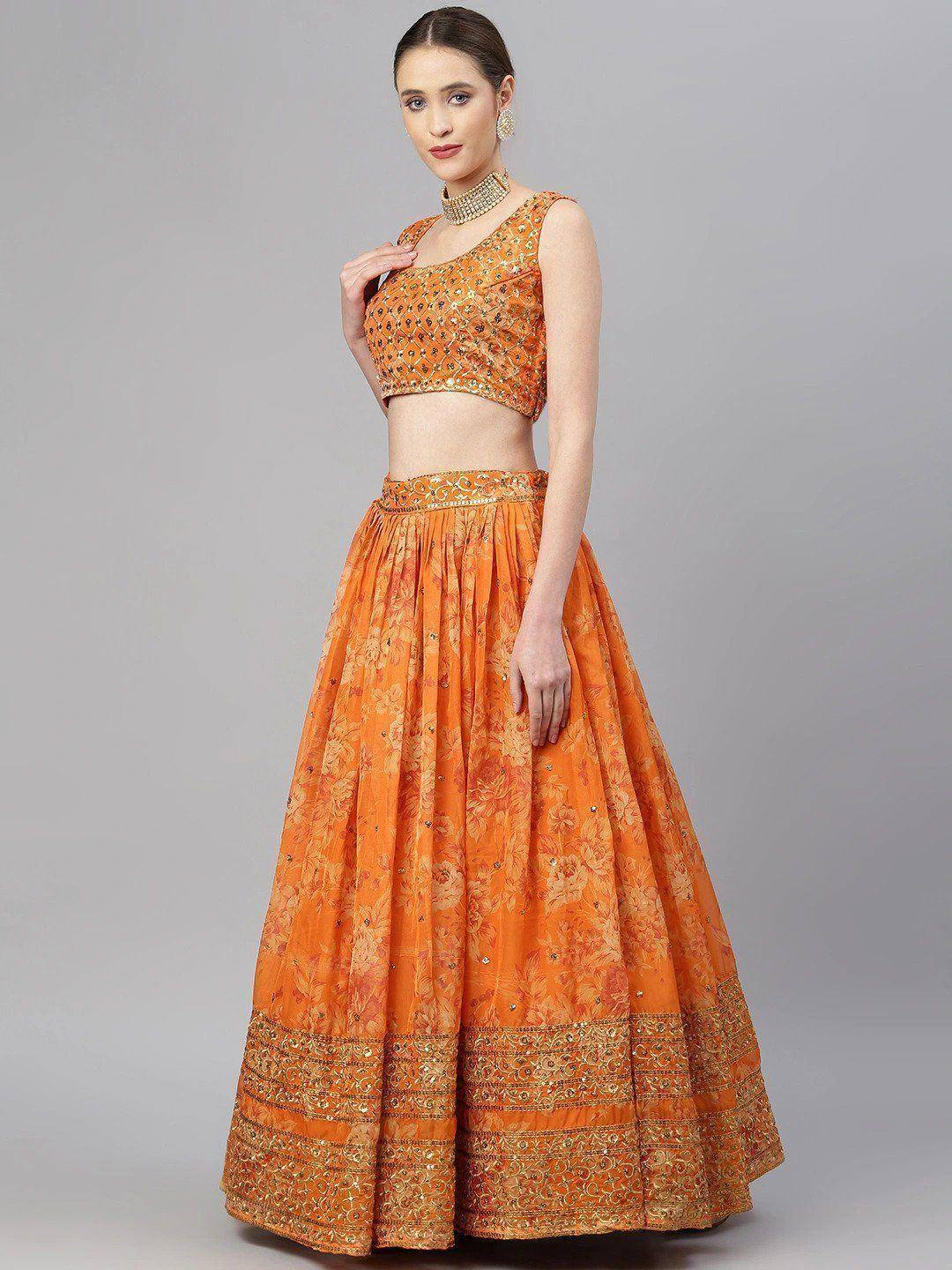 Orange floral lehenga choli with gold embroidery, perfect for Indian ethnic occasions