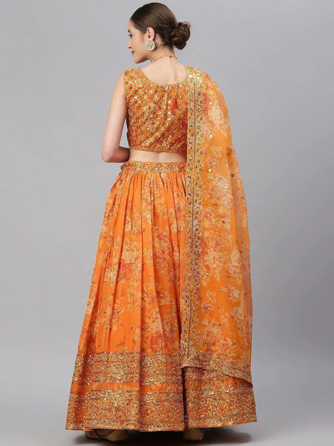 Orange floral lehenga choli with gold embroidery and dupatta, ethnic Indian wear for women