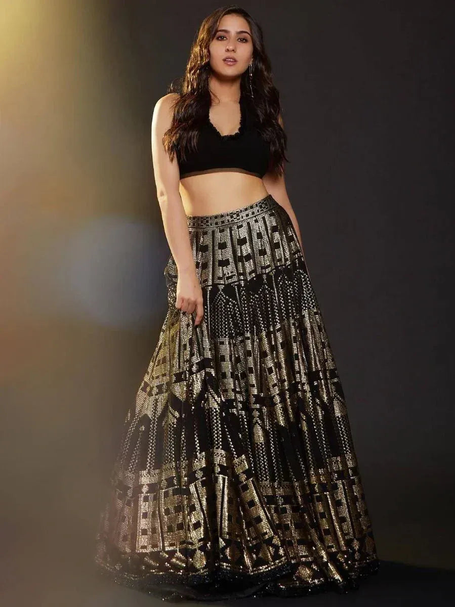 Black and gold embroidered lehenga choli with geometric pattern, perfect for Indian ethnic wear events