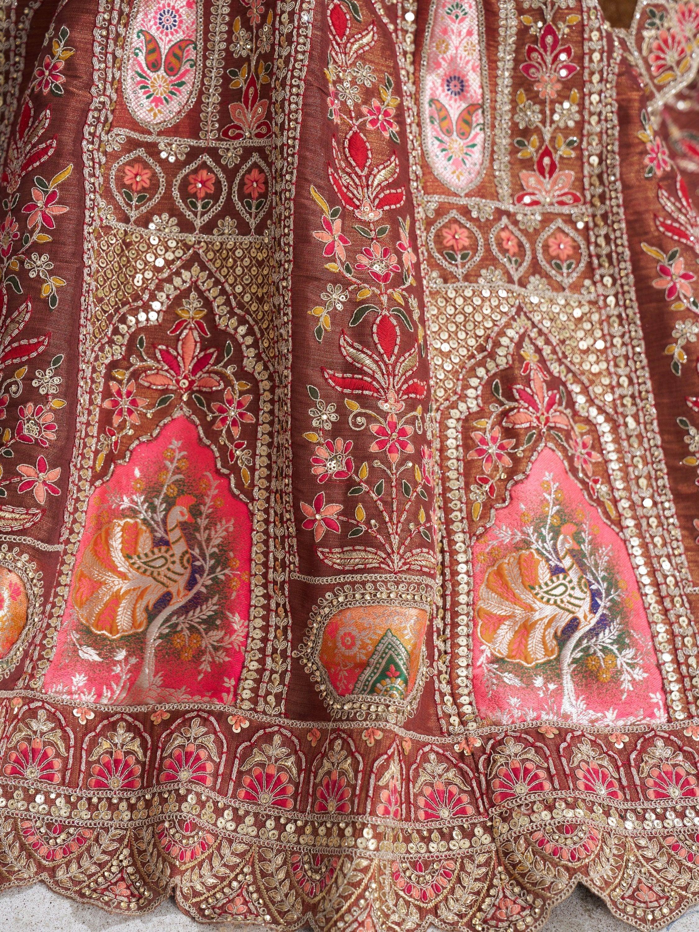 Richly embroidered Indian lehenga with floral and peacock motifs, sequins, and vibrant colors