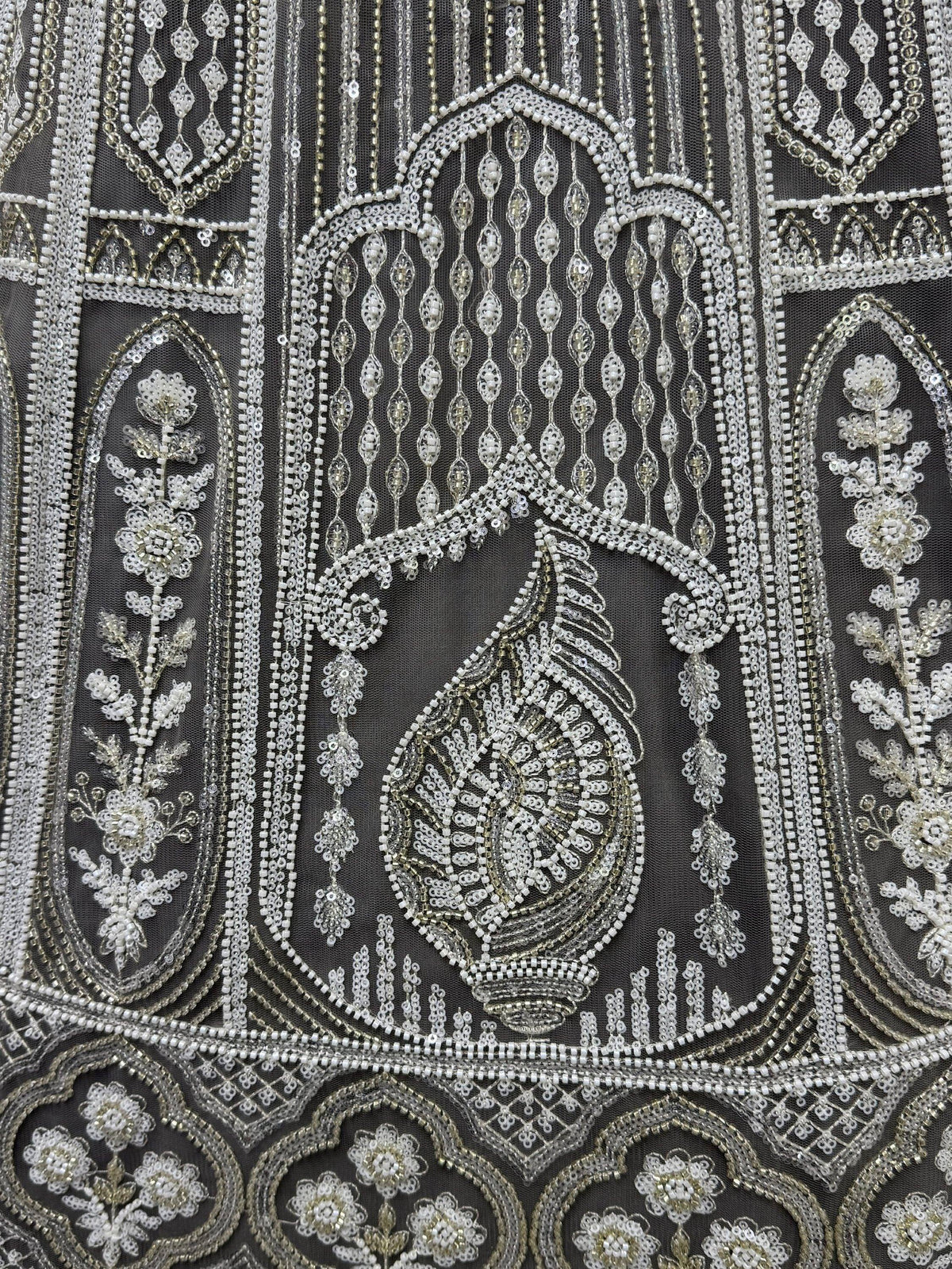 Exquisite silver and white beadwork on black net fabric, perfect for designer lehenga or ethnic gown.
