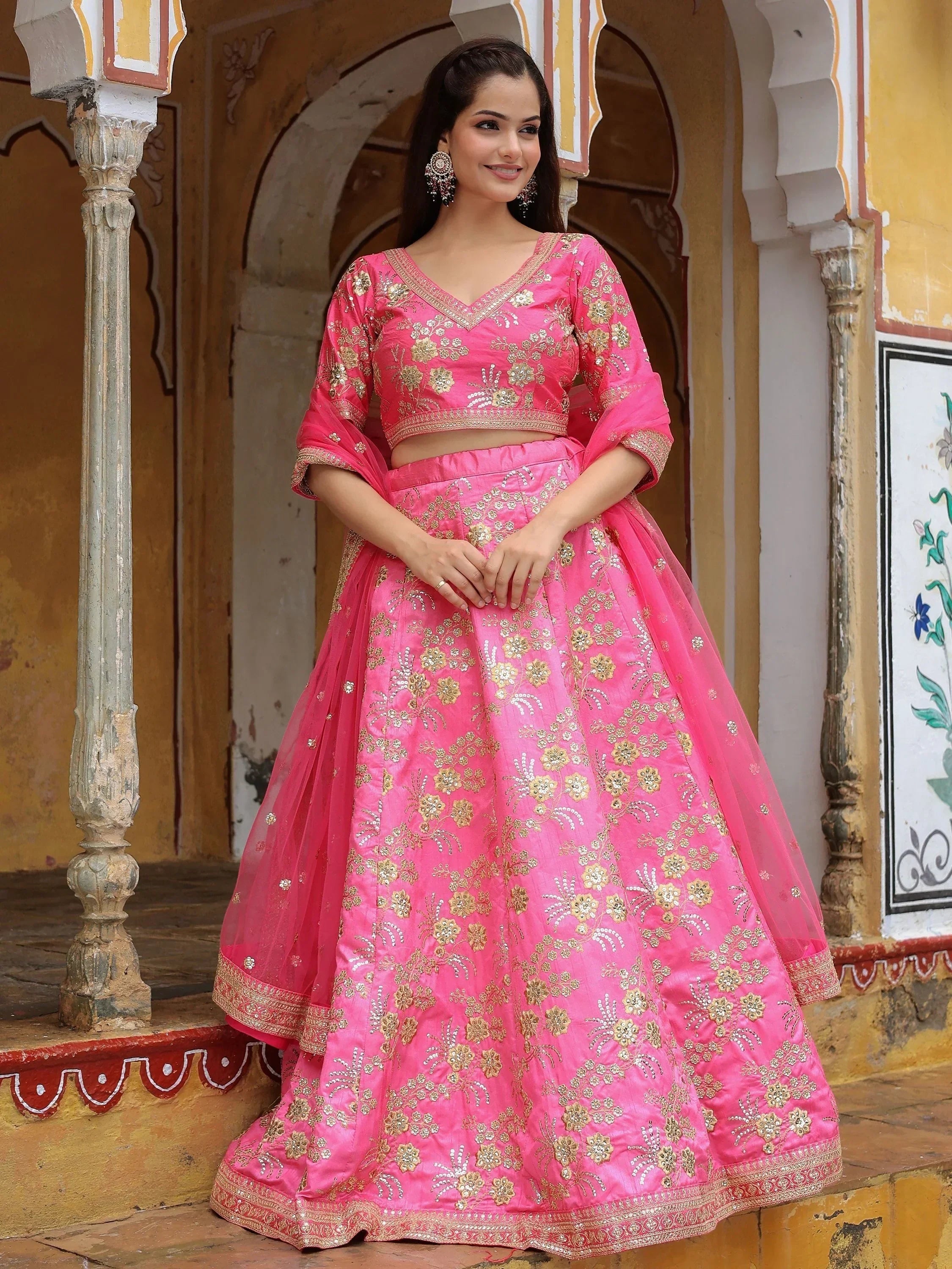 Pink embroidered lehenga choli with gold floral work, perfect for Indian ethnic wear and festive occasions.