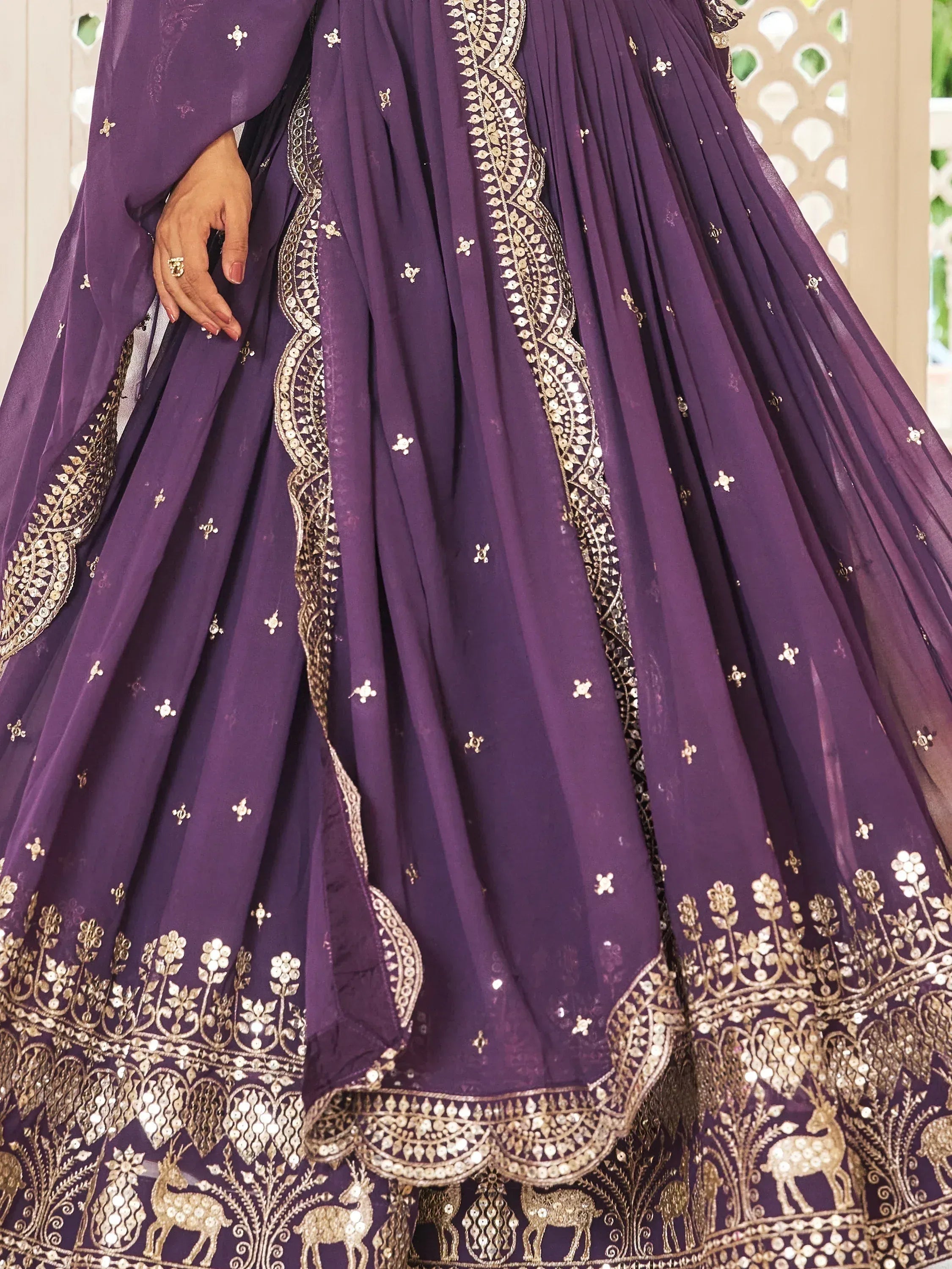Purple designer lehenga with gold embroidery and deer motifs, ethnic Indian wear