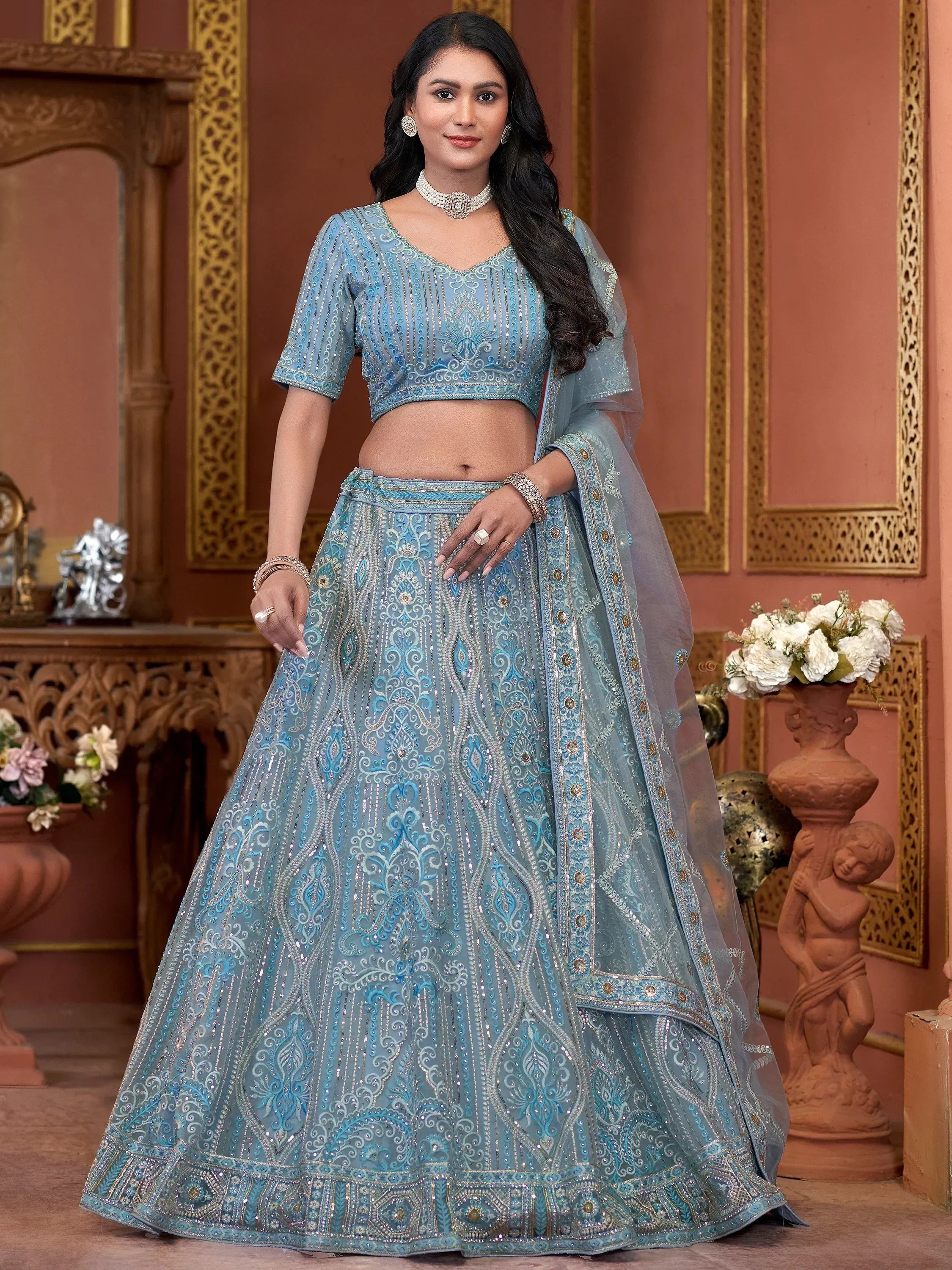 Light blue embroidered lehenga choli with sequins, perfect for Indian weddings and festive occasions.