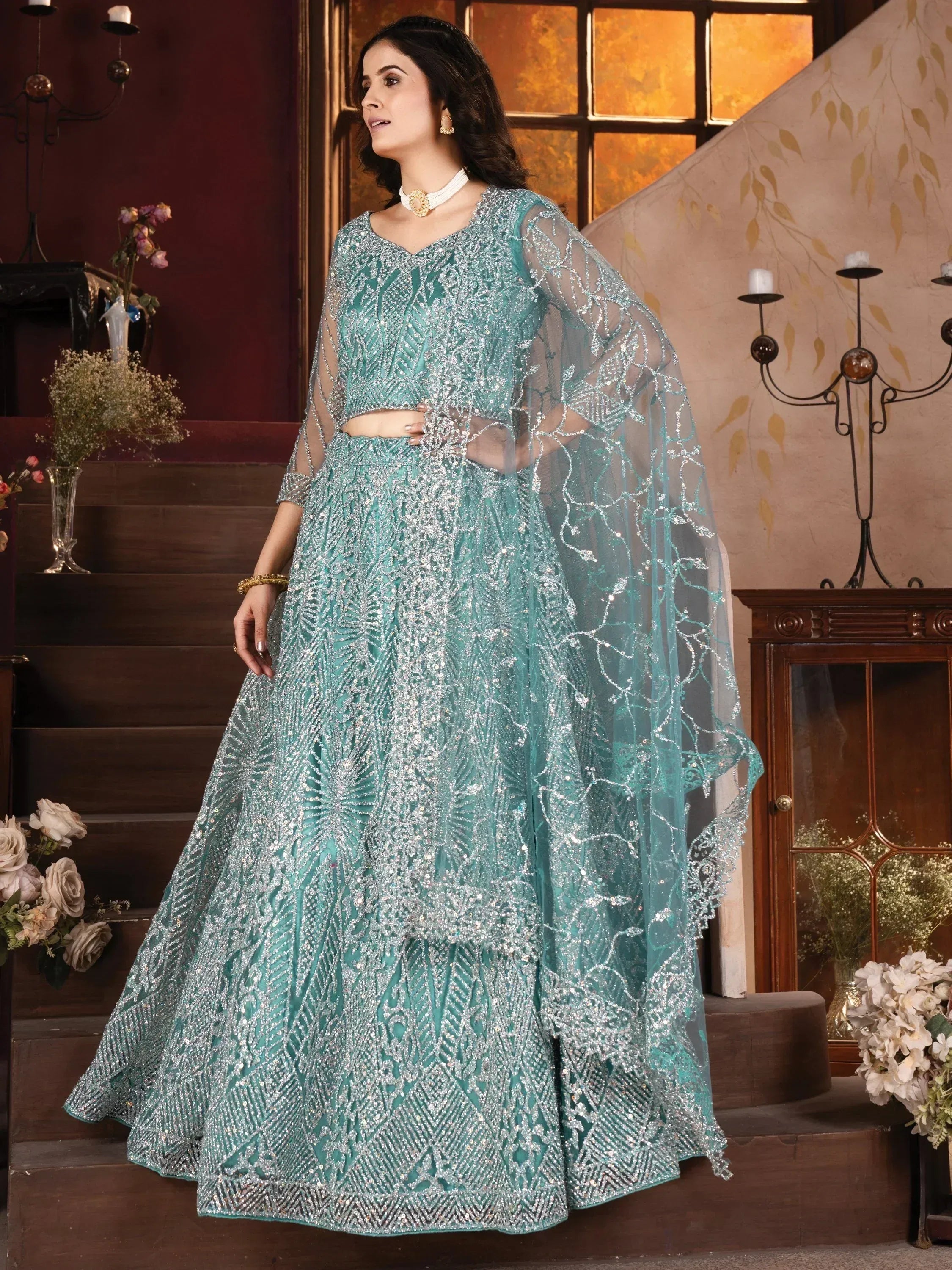 Teal designer lehenga choli with silver embroidery, perfect for Indian weddings and festive occasions