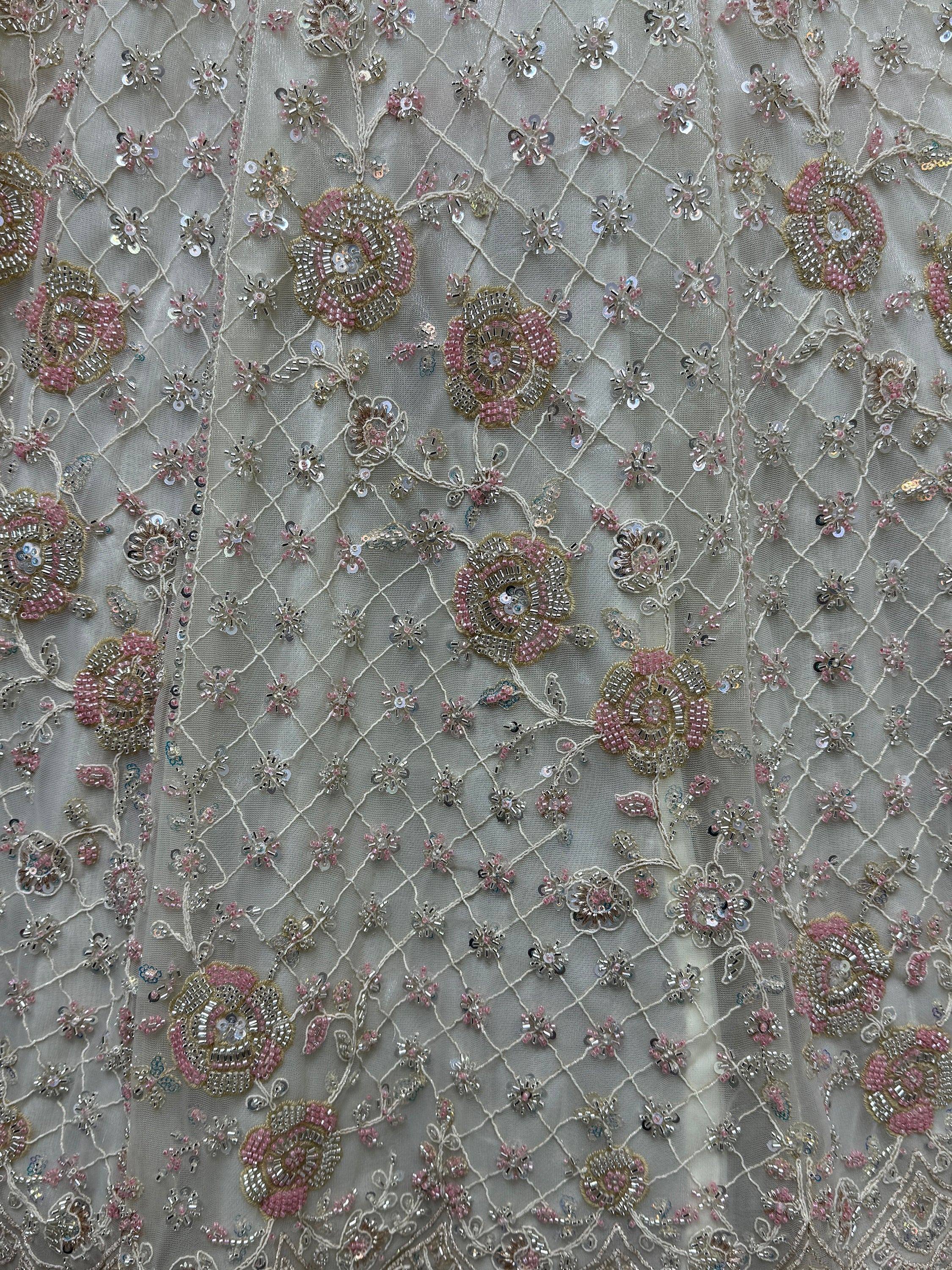 Pink and gold floral embroidery with sequins on sheer net fabric for ethnic wear