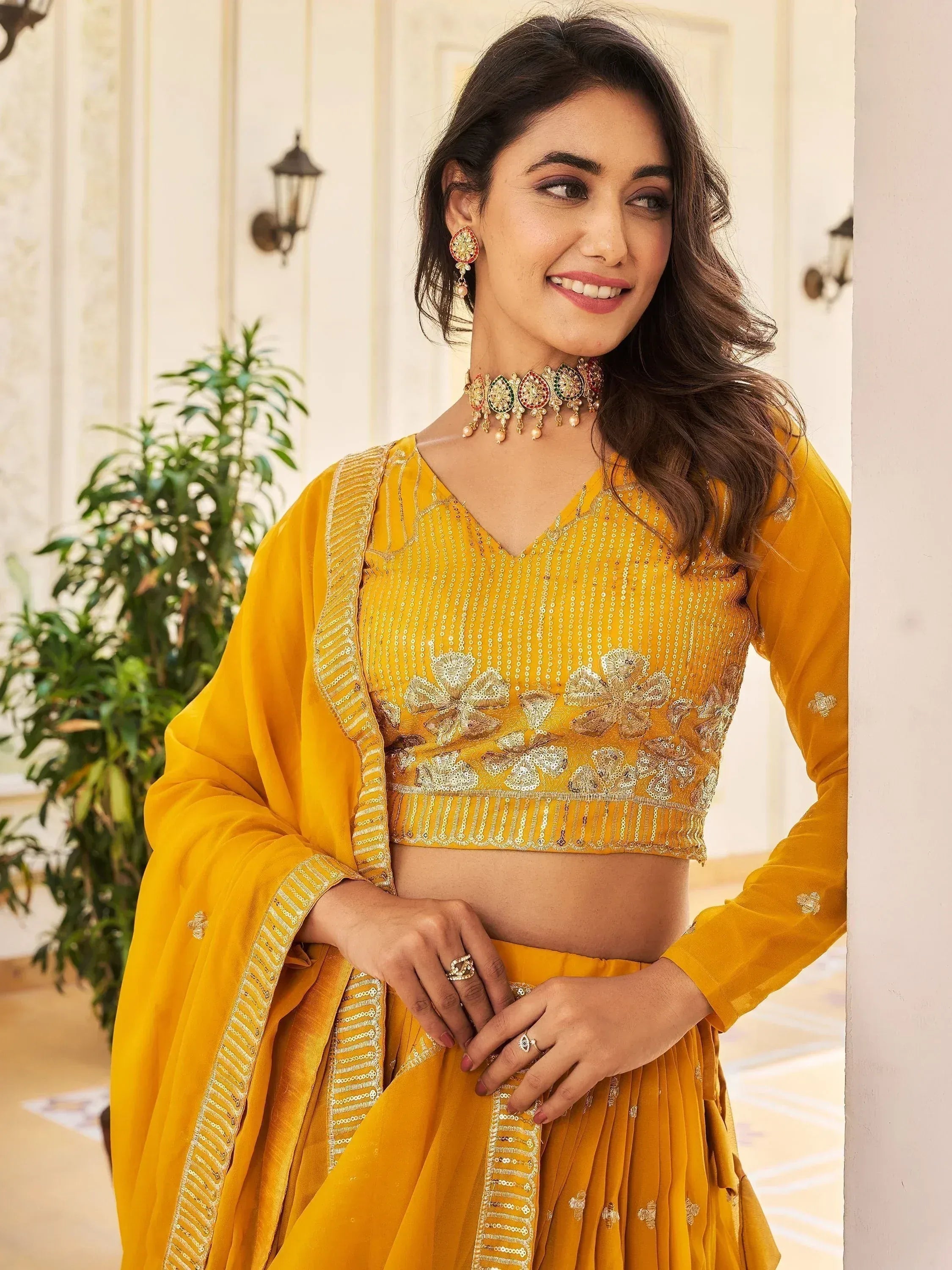 Yellow embroidered lehenga choli with sequin work, perfect for Indian ethnic wear and festive occasions