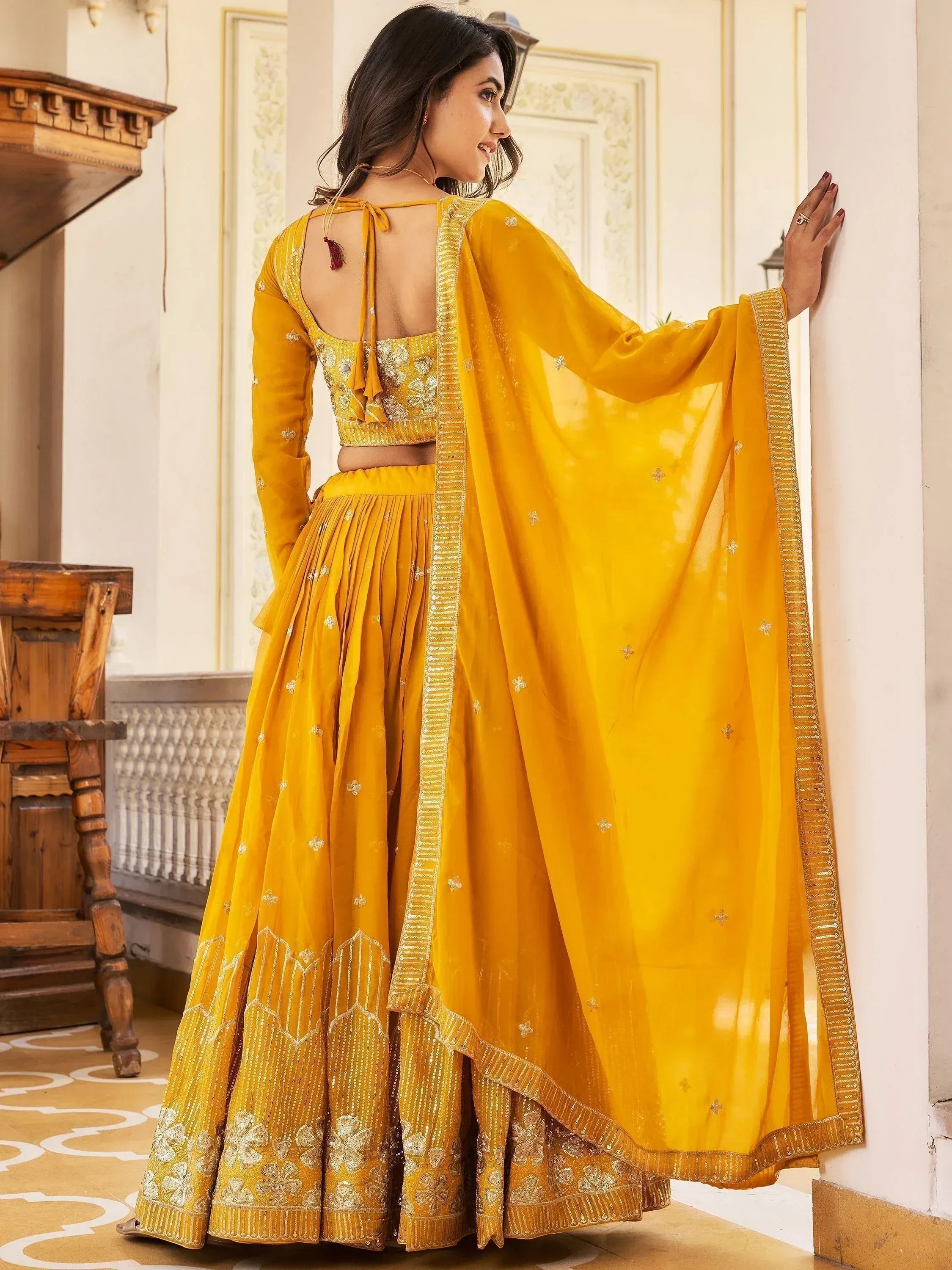 Yellow designer lehenga choli with embroidery, perfect for Indian ethnic wear and festive occasions.