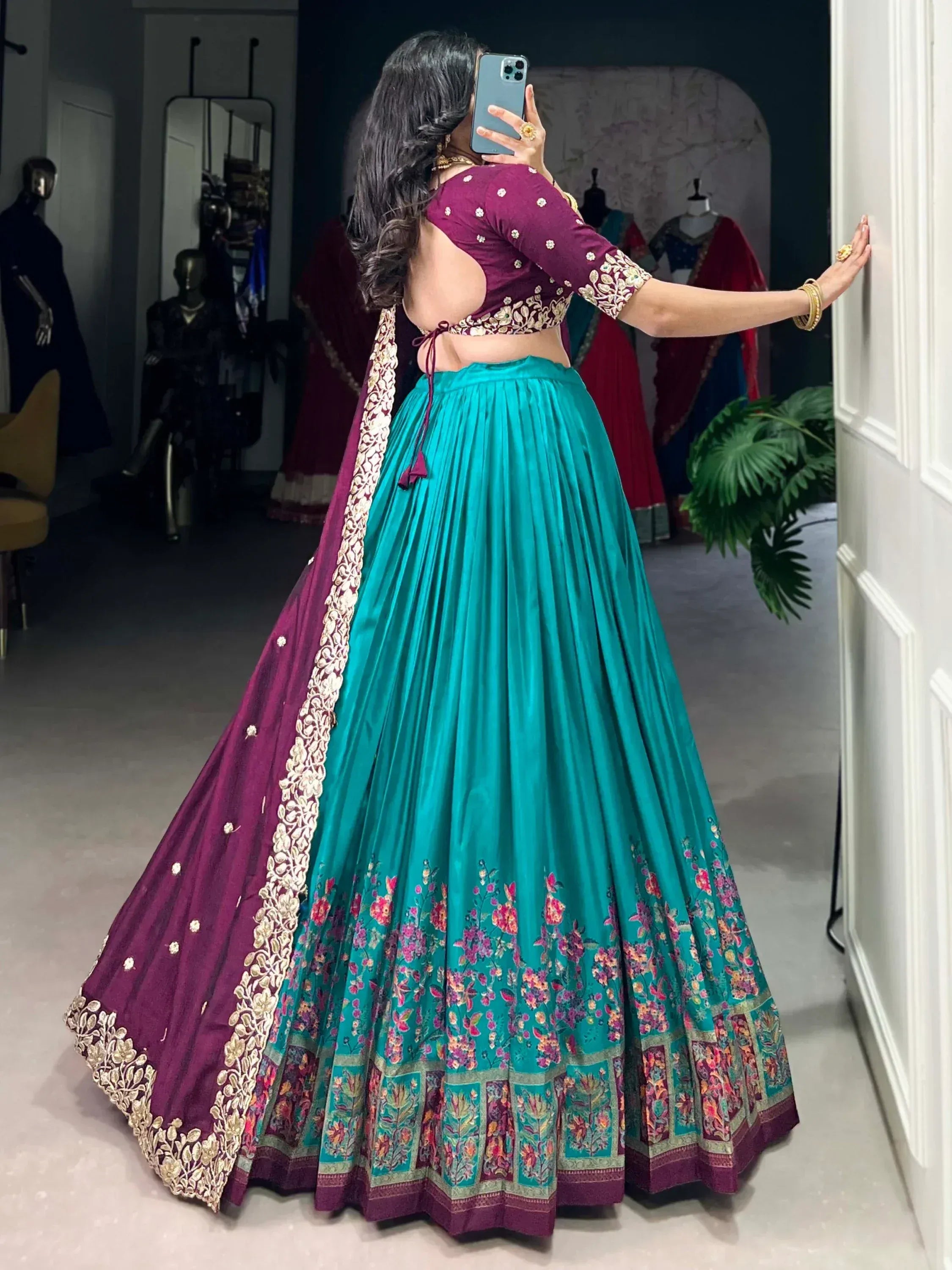 Teal and maroon designer lehenga choli with floral embroidery, perfect for Indian ethnic wear occasions