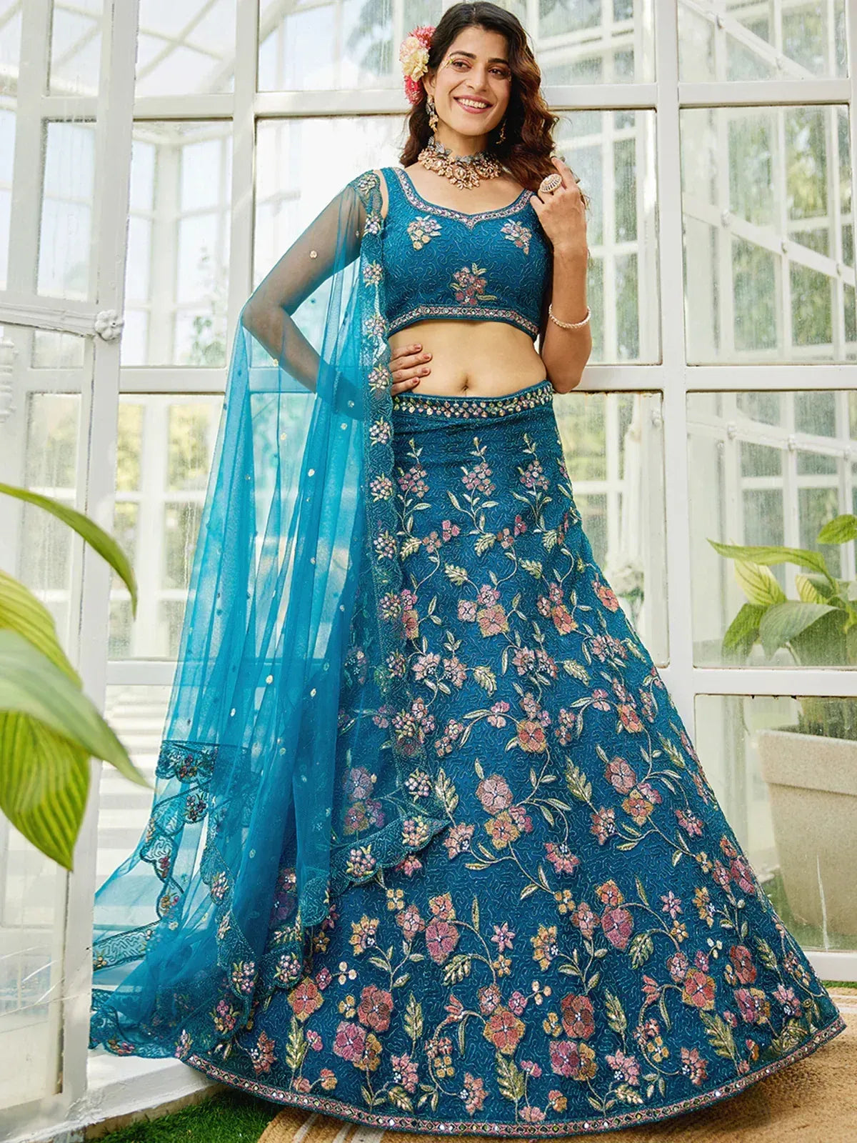 Teal floral embroidered lehenga choli with sheer dupatta, perfect for Indian ethnic occasions