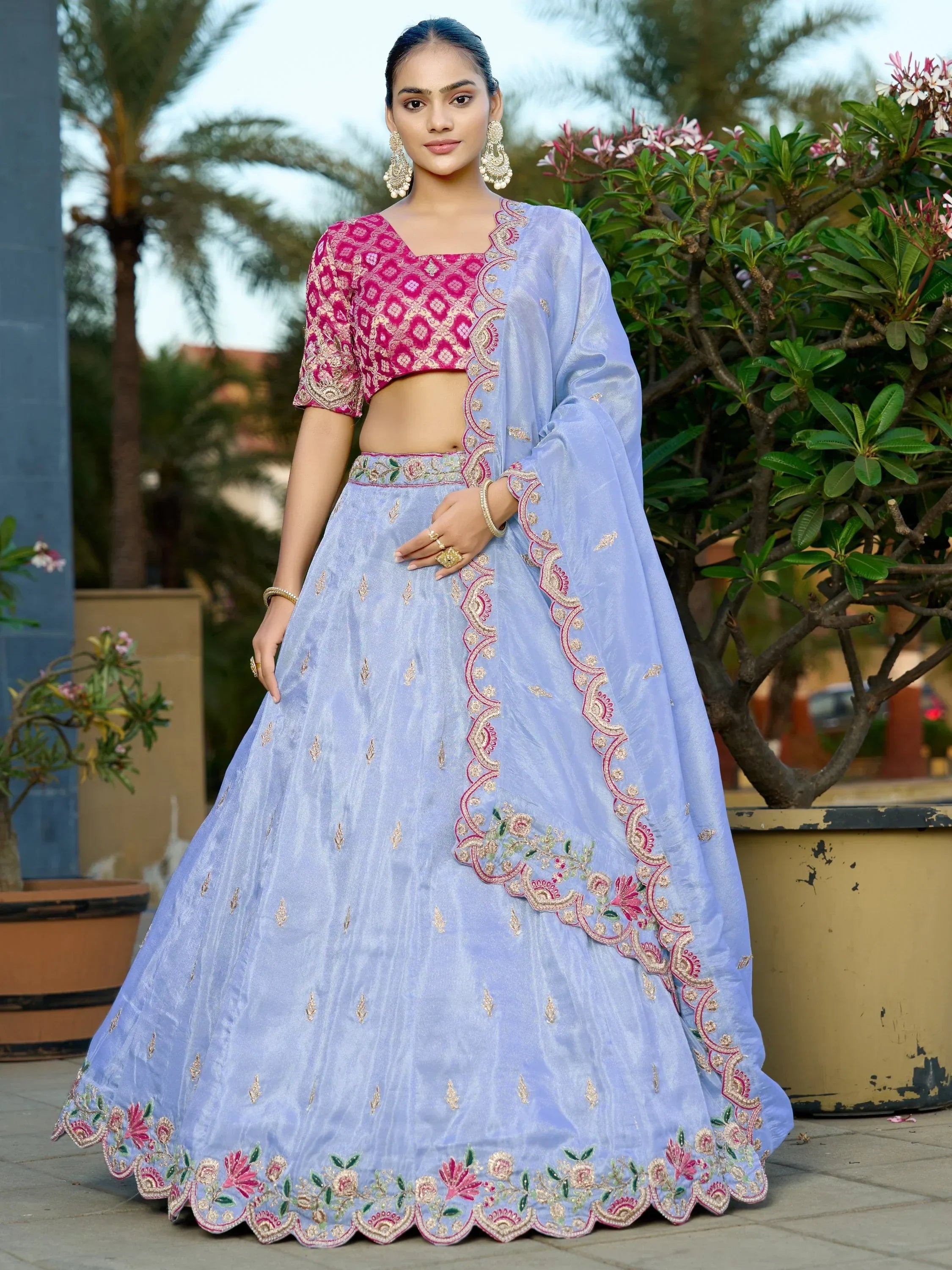 Light blue embroidered lehenga choli with pink blouse, perfect for Indian ethnic occasions and weddings