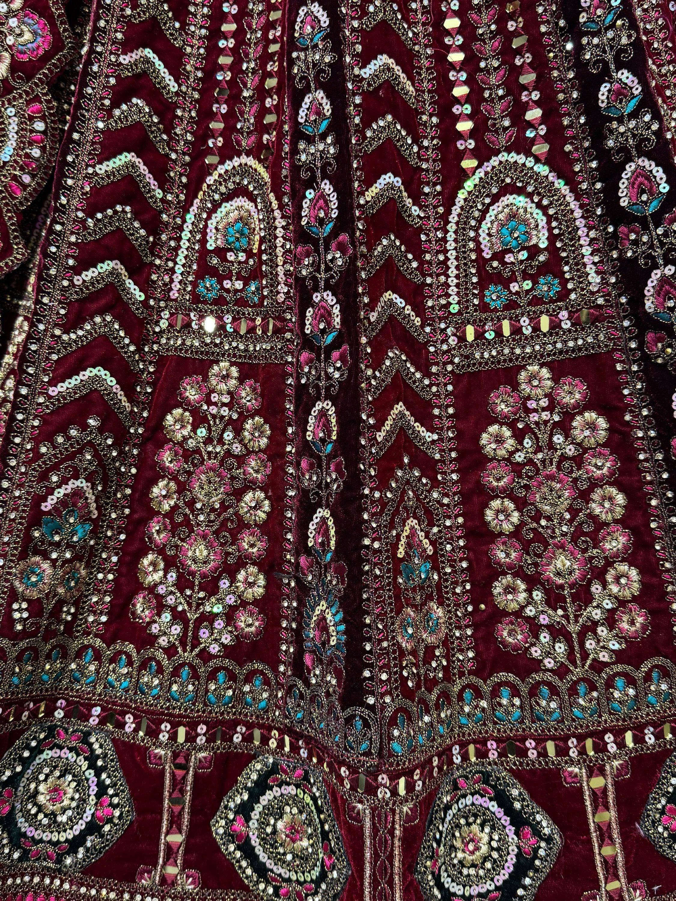 Richly embroidered maroon velvet lehenga choli with floral sequin and beadwork details